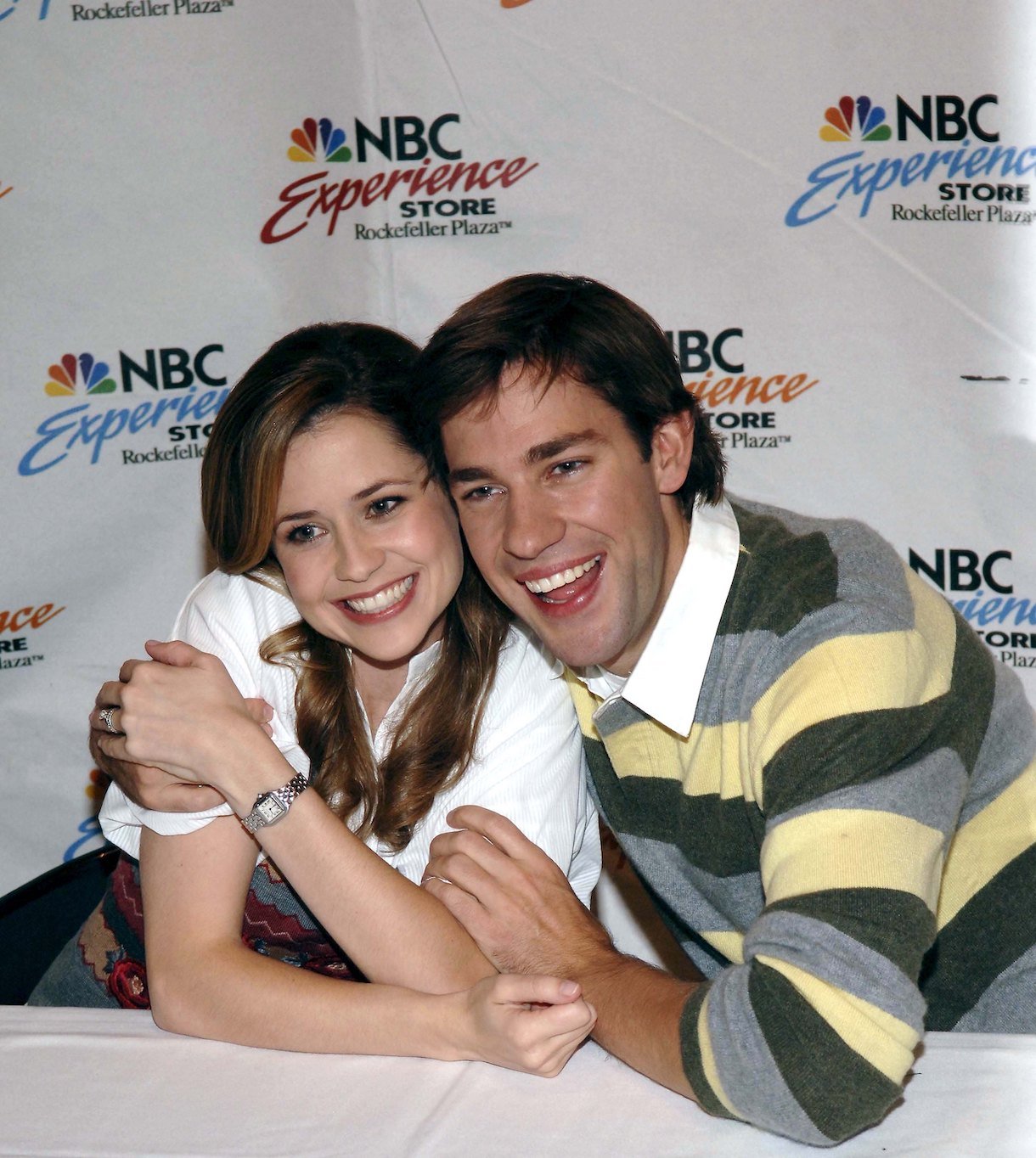 Actors John Krasinski (R) and Jenna Fischer pose at the NBC Experience store at "The Office" DVD release signing on September 21, 2006 in New York City