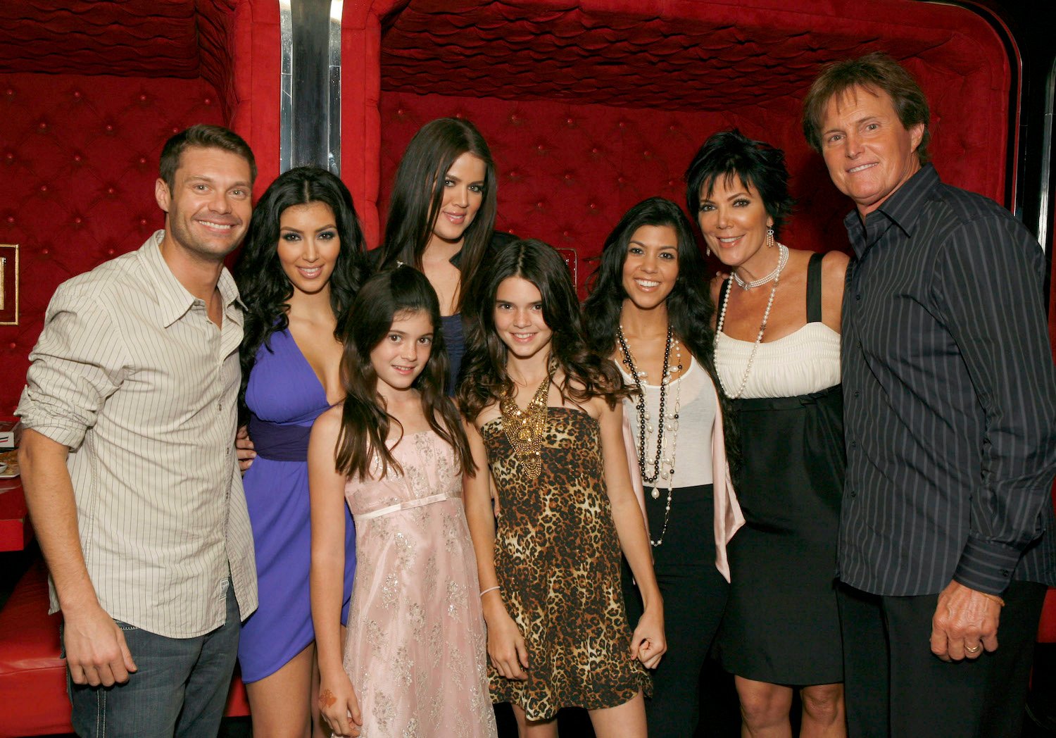 Ryan Seacrest, Kim Kardashian, Kylie Jenner, Khloe Kardashian, Kendall Jenner, Kourtney Kardashian, Kris Jenner, and Bruce Jenner pose for a photo at the 'Keeping Up With the Kardashians' viewing party