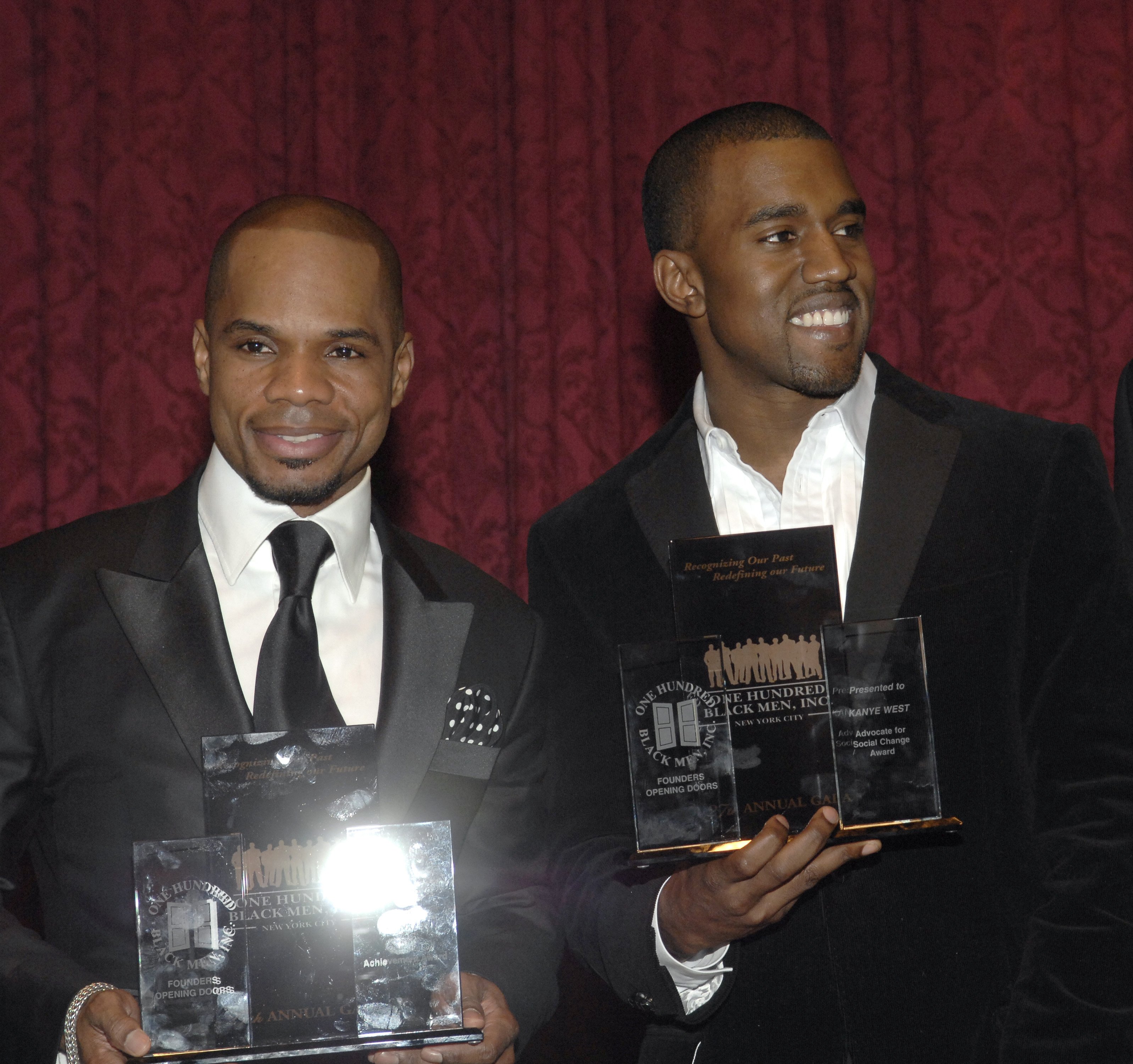Kirk Franklin and Kanye West holding plaques