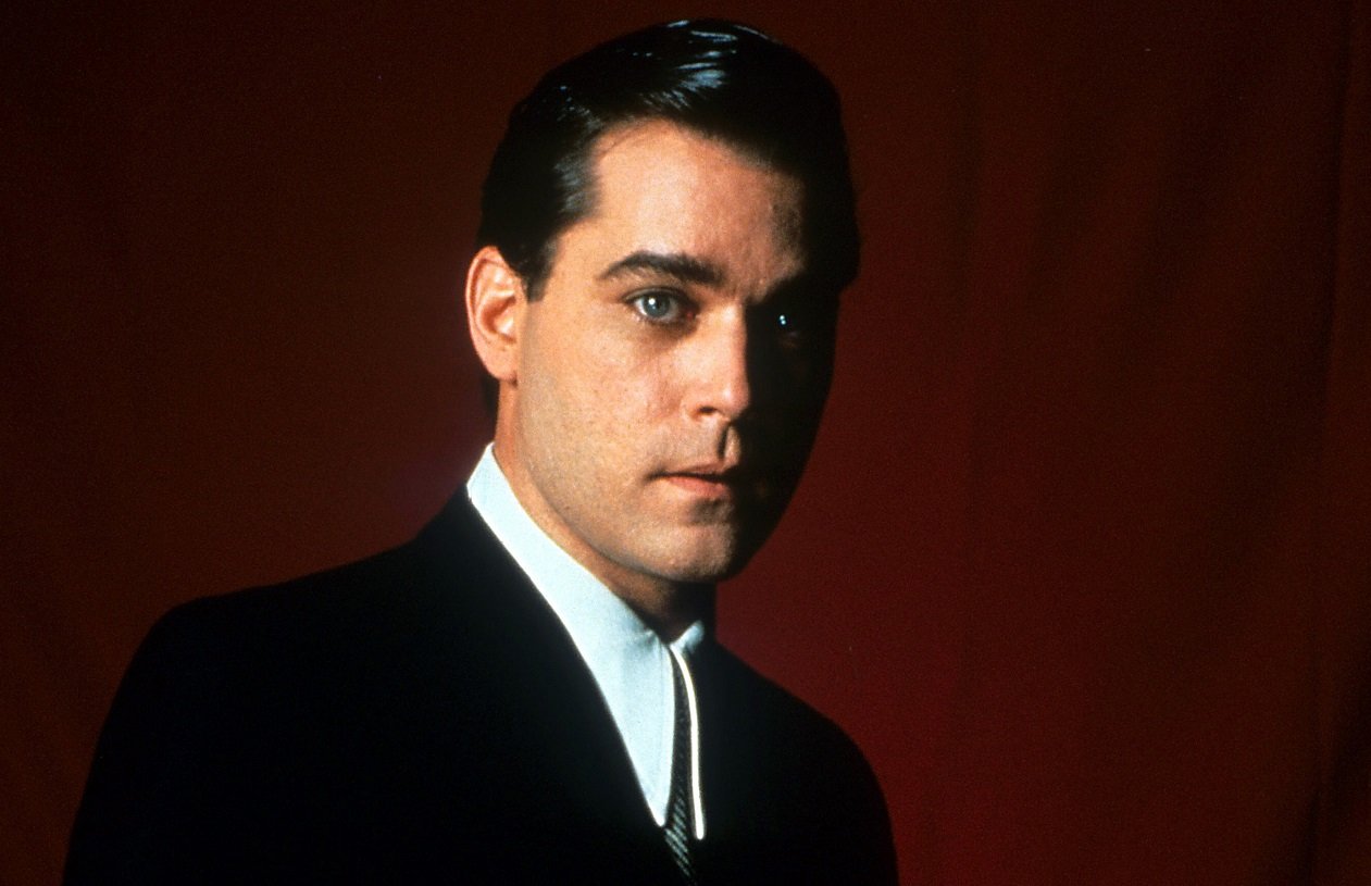 Ray Liotta poses in a black suit as Henry Hill in 'Goodfellas'