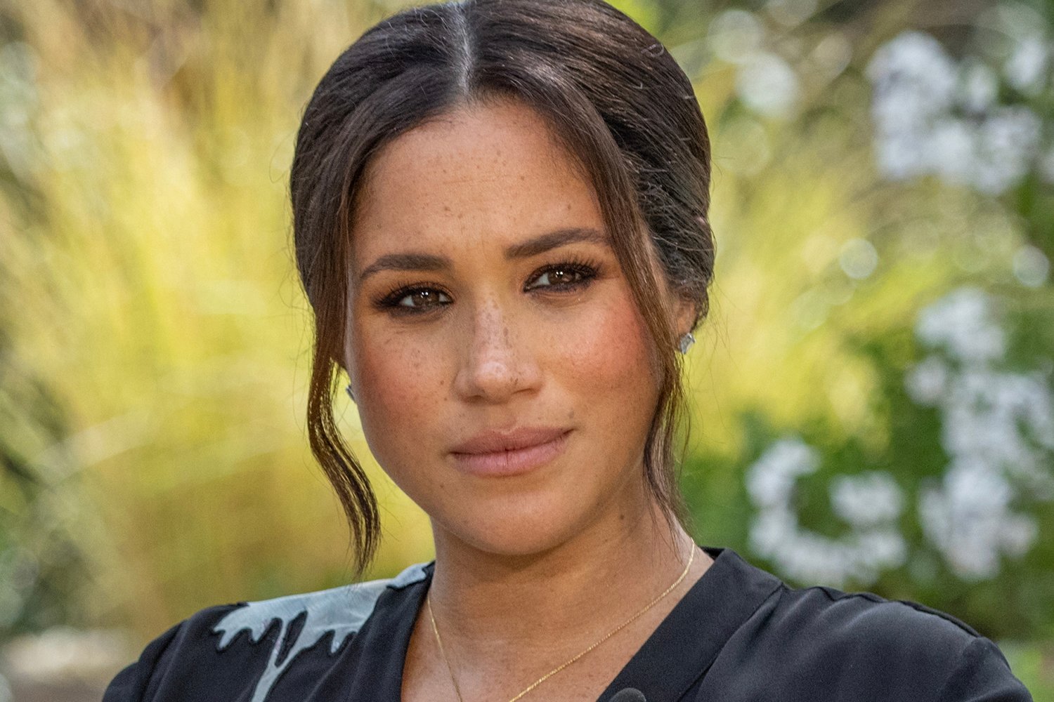 A close up of Meghan Markle's face during her Oprah Winfrey interview