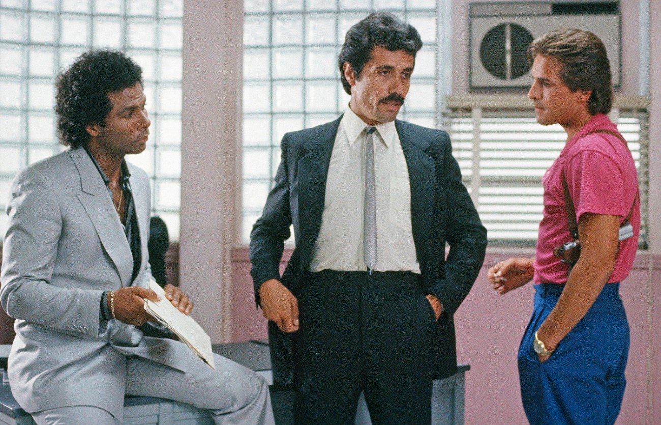 Philip Michael Thomas as Tubbs and Don Johnson as Crockett look on as Edward James Olmos as Lt. Castillo speaks in 'Miami Vice'