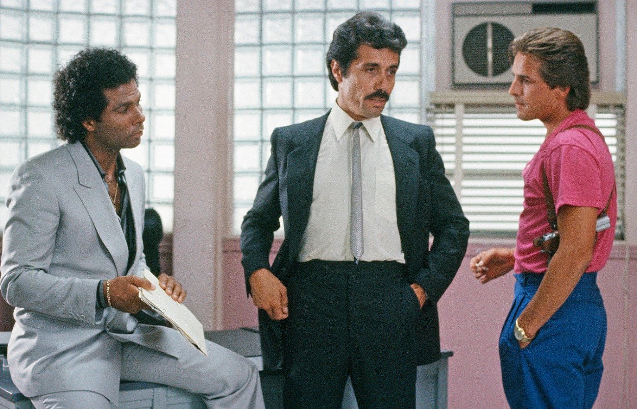 Philip Michael Thomas as Tubbs and Don Johnson as Crockett look on as Edward James Olmos as Lt. Castillo speaks in 'Miami Vice'