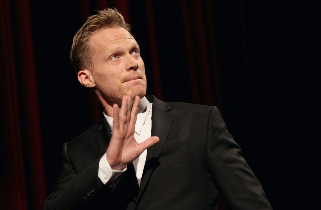 Paul Bettany gestures on stage after the 'Margin Call' Premiere during day two of the 61st Berlin International Film Festival