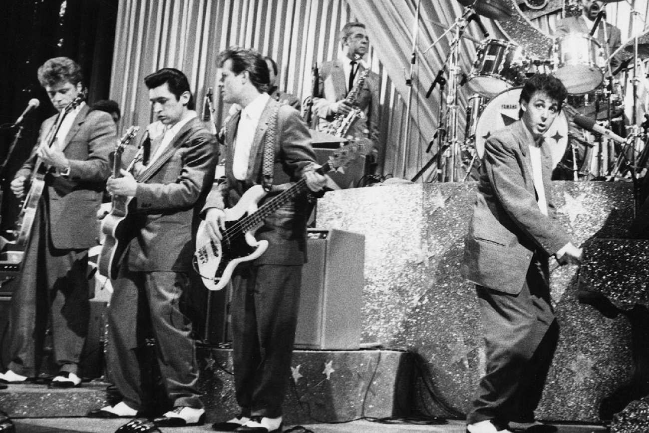 Paul McCartney plays piano in a scene from 'Give My Regards to Broad Street', 1984. John Paul Jones plays bass behind him.