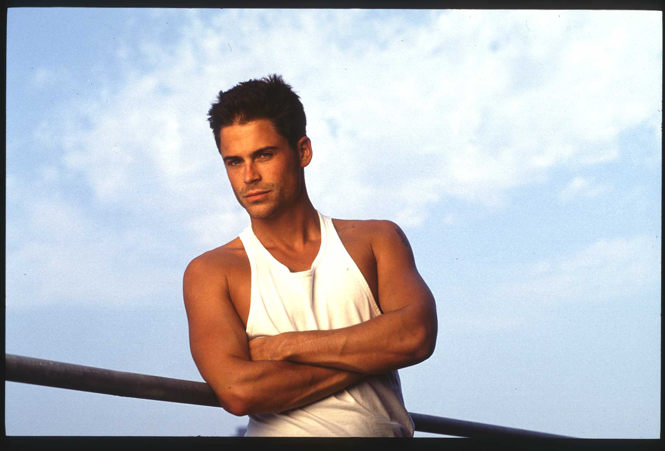 Young Rob Lowe in a white shirt