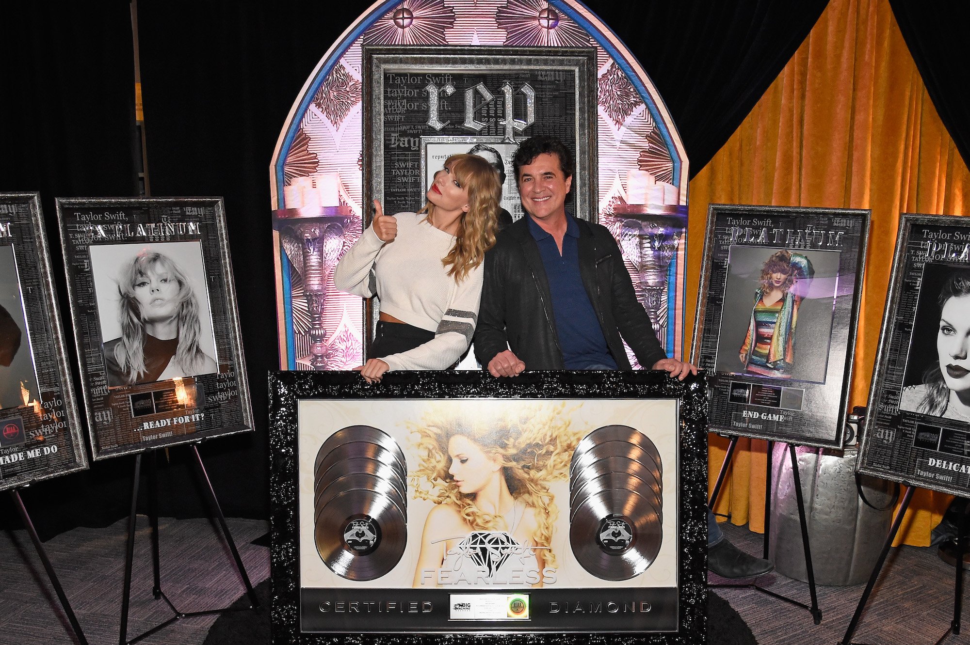 Taylor Swift and CEO of Big Machine Records Scott Borchetta plaque presentation at the Taylor Swift reputation Stadium Tour on July 21, 2018