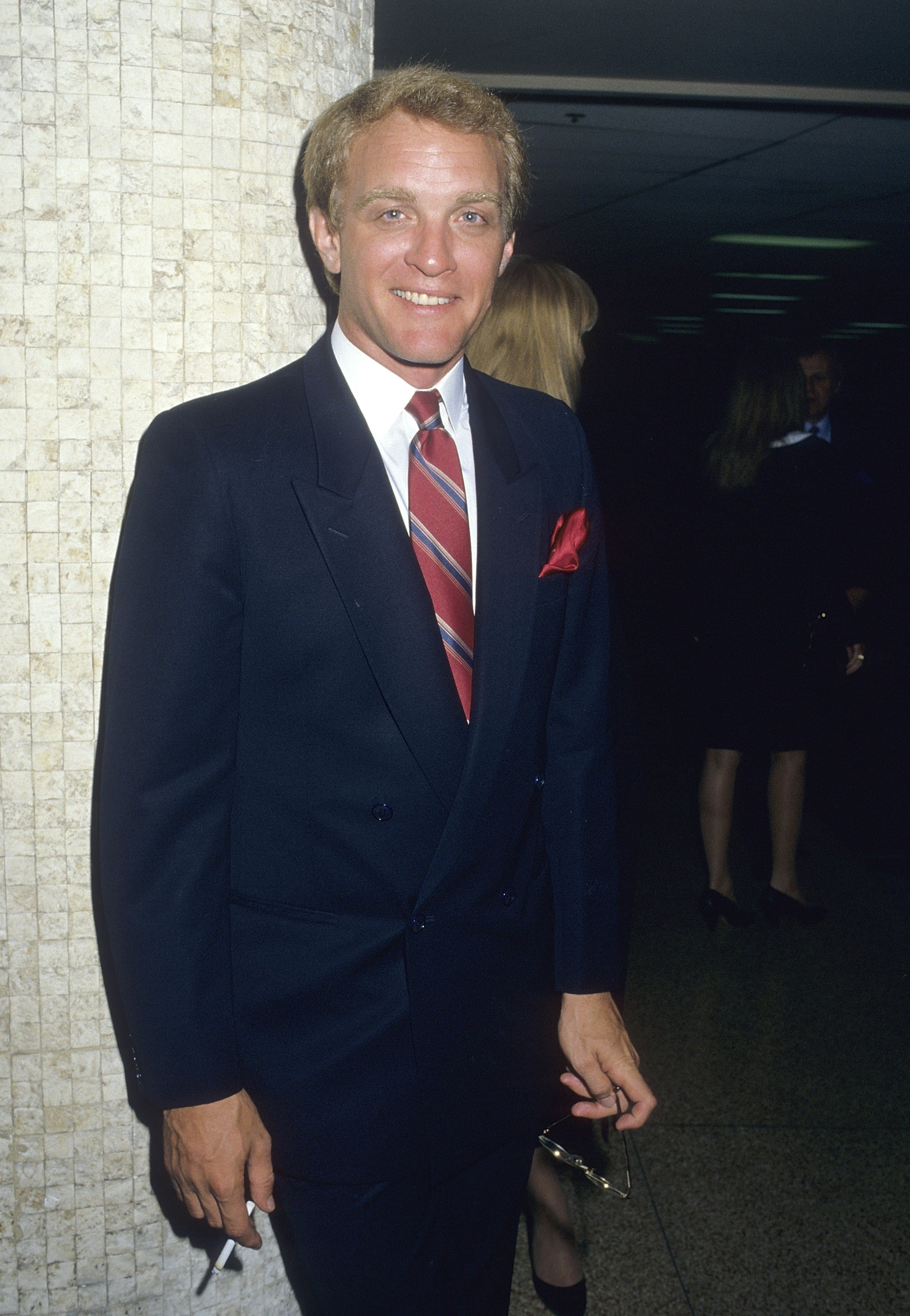 Actor Terry Lester in 1988 standing at a party