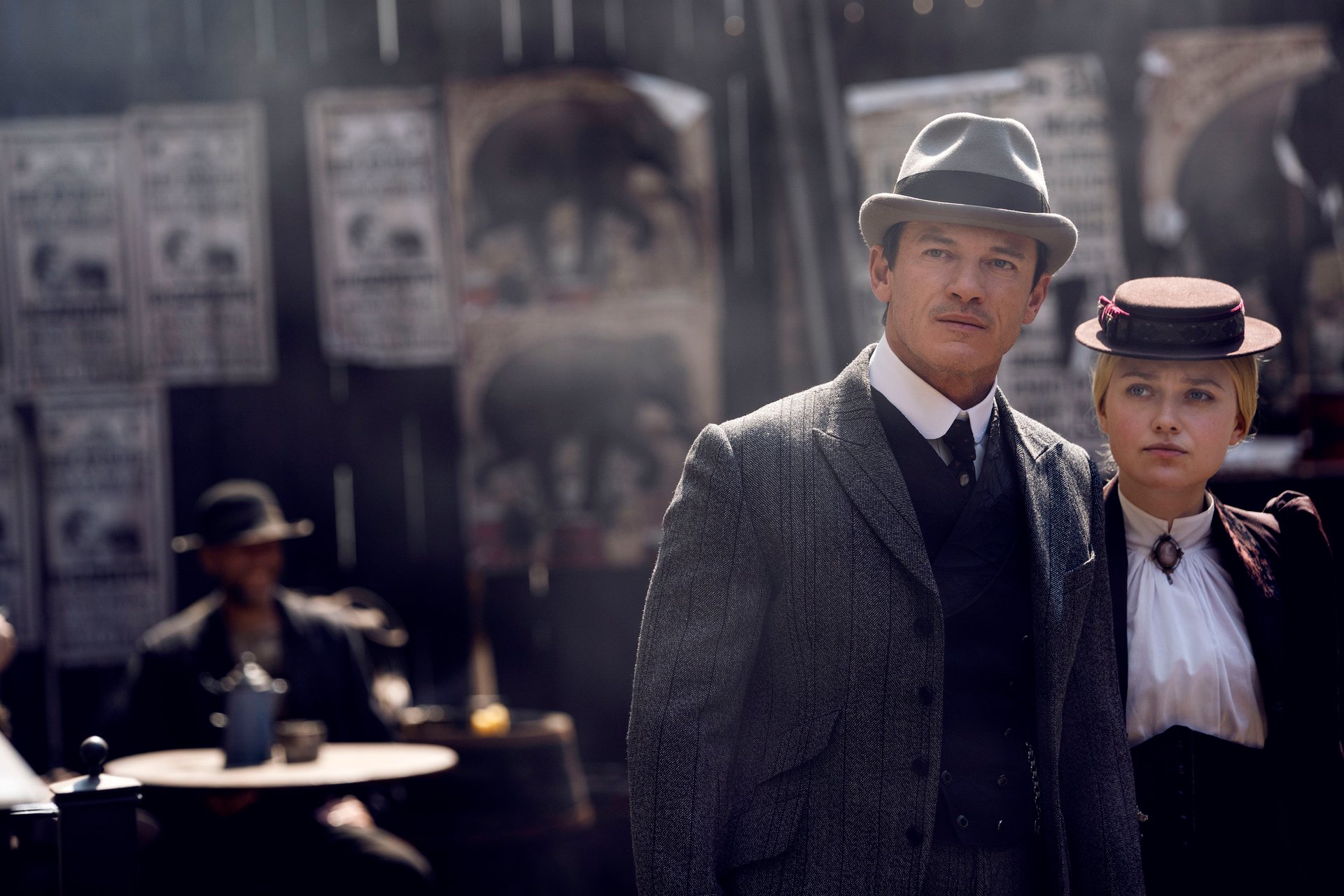 Luke Evans and Dakota Fanning looking concerned in The Alienist: Angel of Darkness