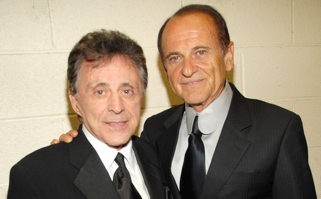 Frankie Valli and Joe Pesci smile and pose for the camera