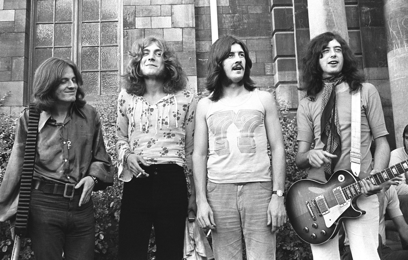 Led Zeppelin posing in a garden, 1969