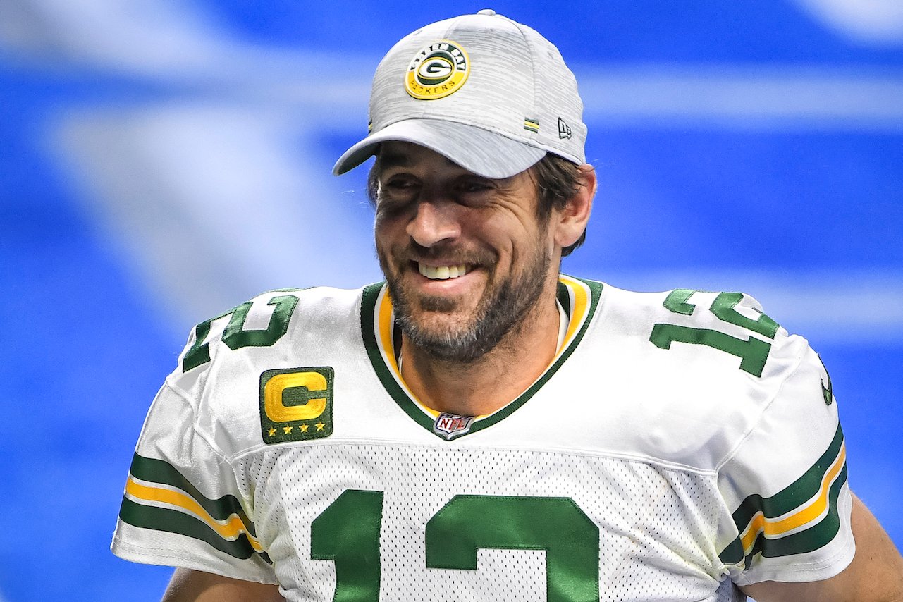 Aaron Rodgers of the Green Bay Packers looks on and smiles after the win against the Detroit Lions at Ford Field