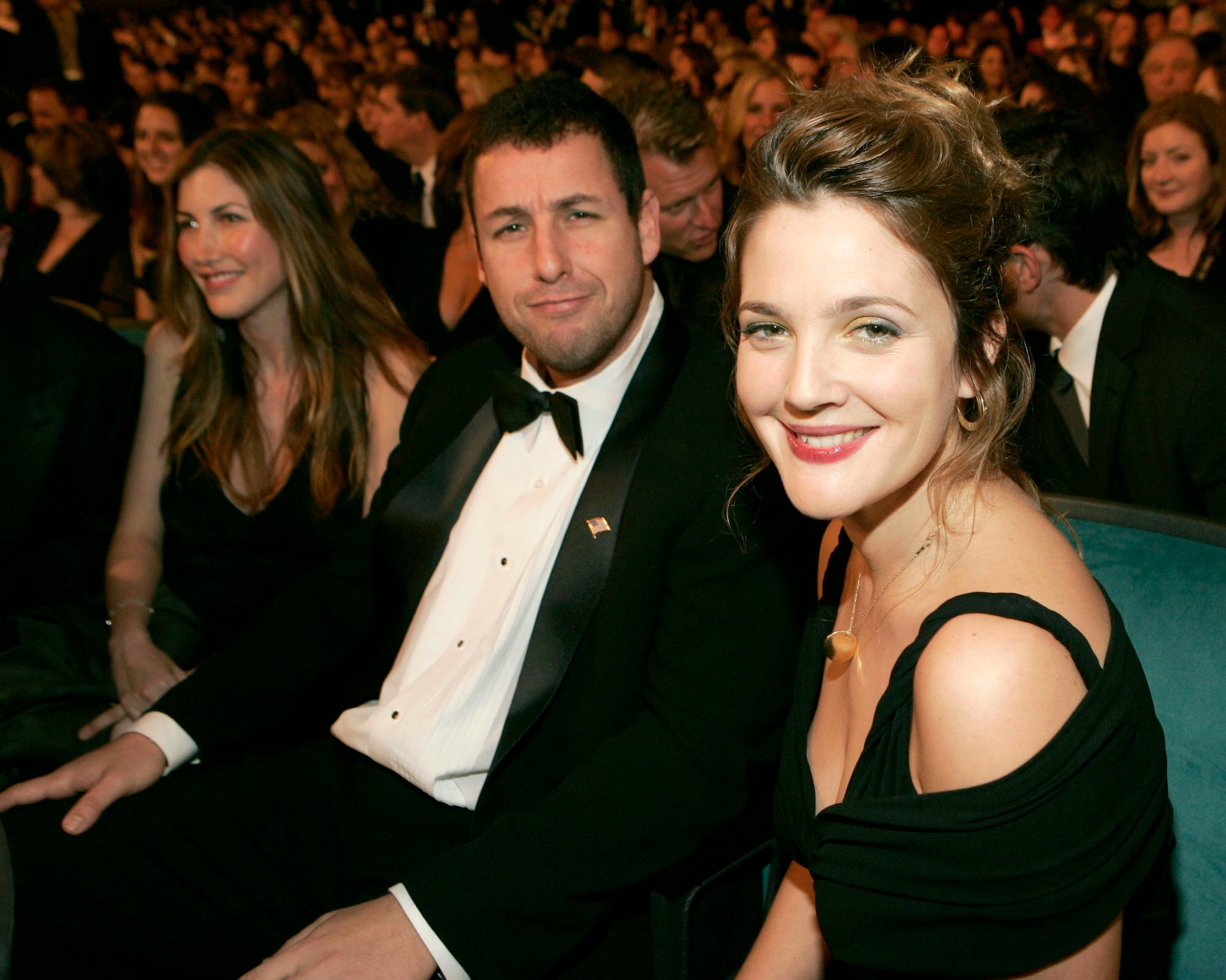 (L-R) Adam Sandler and Drew Barrymore smiling at the camera