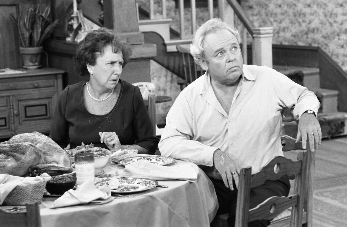 Carroll O'Connor and Jean Stapleton looking surprised on the set of "All in the Family"
