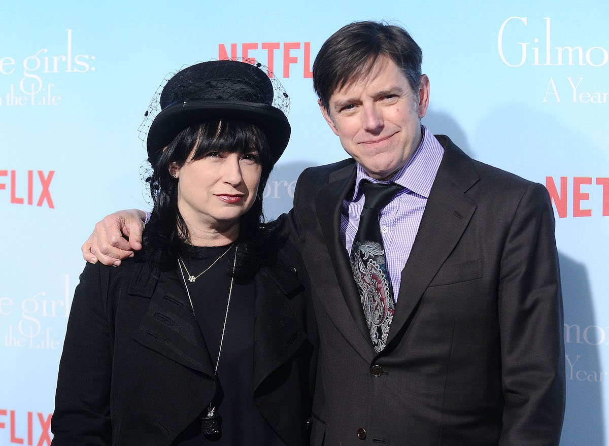 Amy Sherman-Palladino and Daniel Palladino smile for cameras as they arrive at the premiere of 'Gilmore Girls: A Year in the Life'