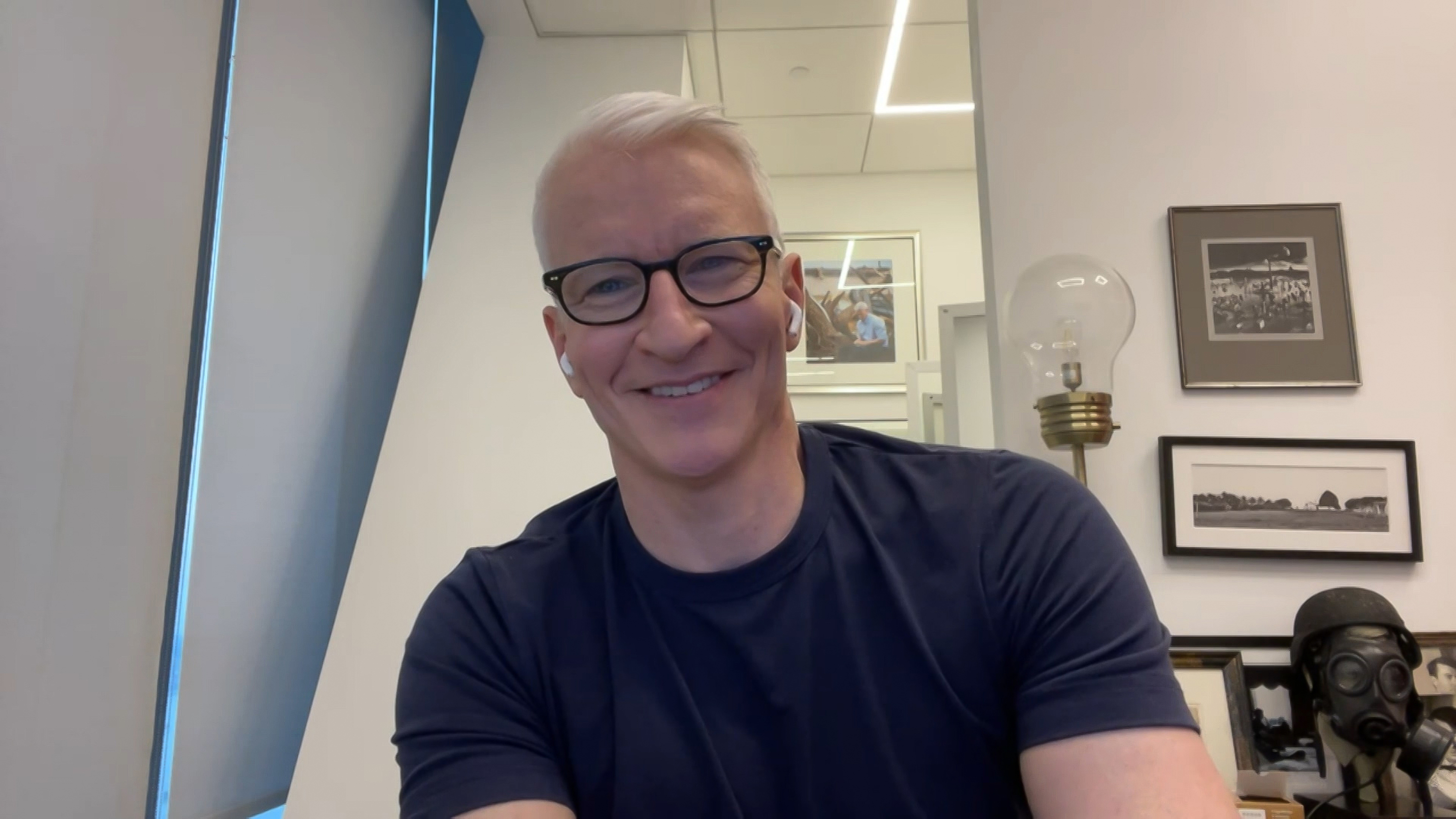 CNN star Anderson Cooper smiling in a black T-shirt