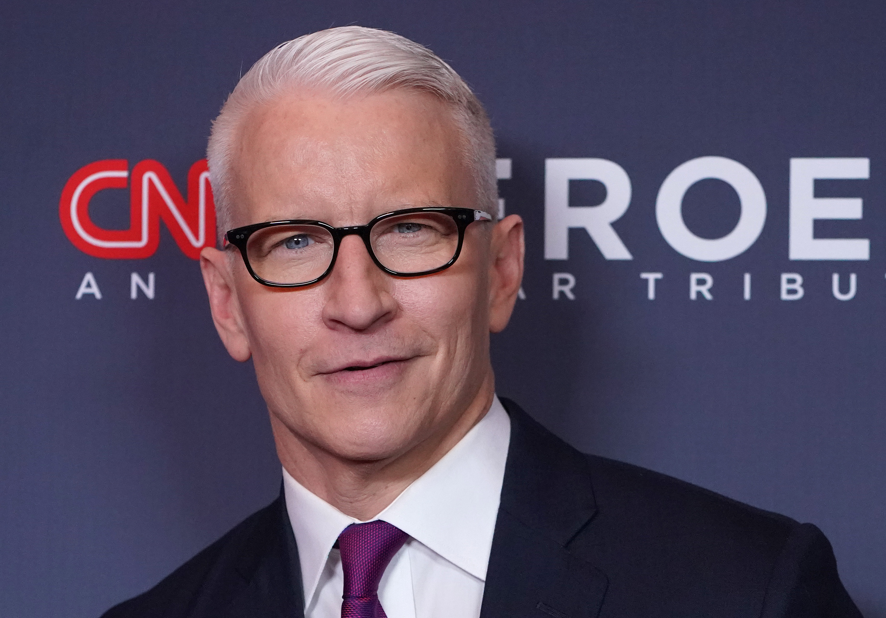 Anderson Cooper smiling for cameras as he attends the 13th Annual CNN Heroes at the American Museum of Natural History