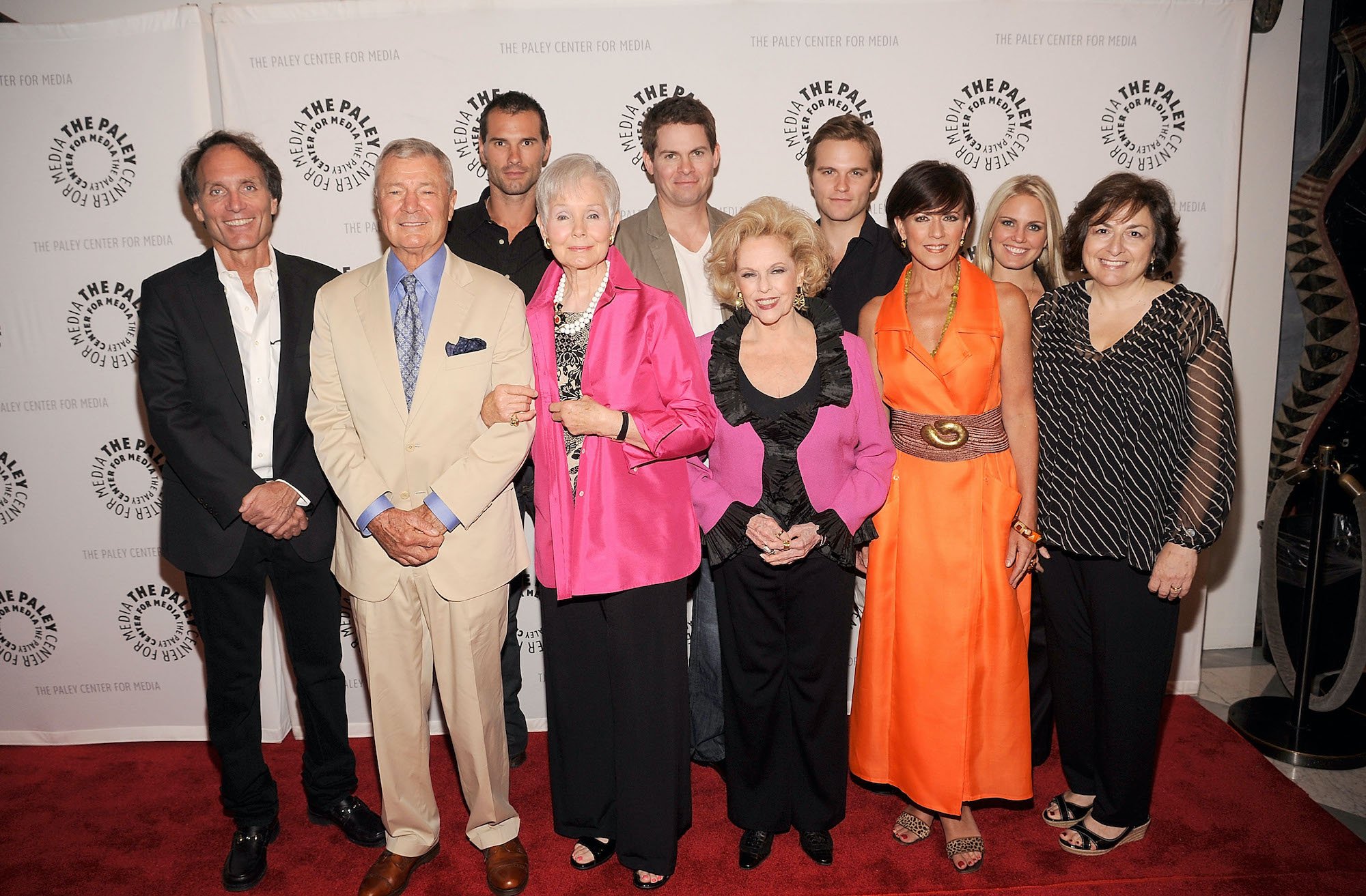 (L-R, 2nd row) Actors Austin Peck, Trent Dawson, Van Hansis, (L-R, front row) executive producer Christopher Goutman, actors Don Hastings, Kathy Hays, Eileen Fulton, Colleen Zenk, Terry Colombino, and writer Jean Passanante smiling
