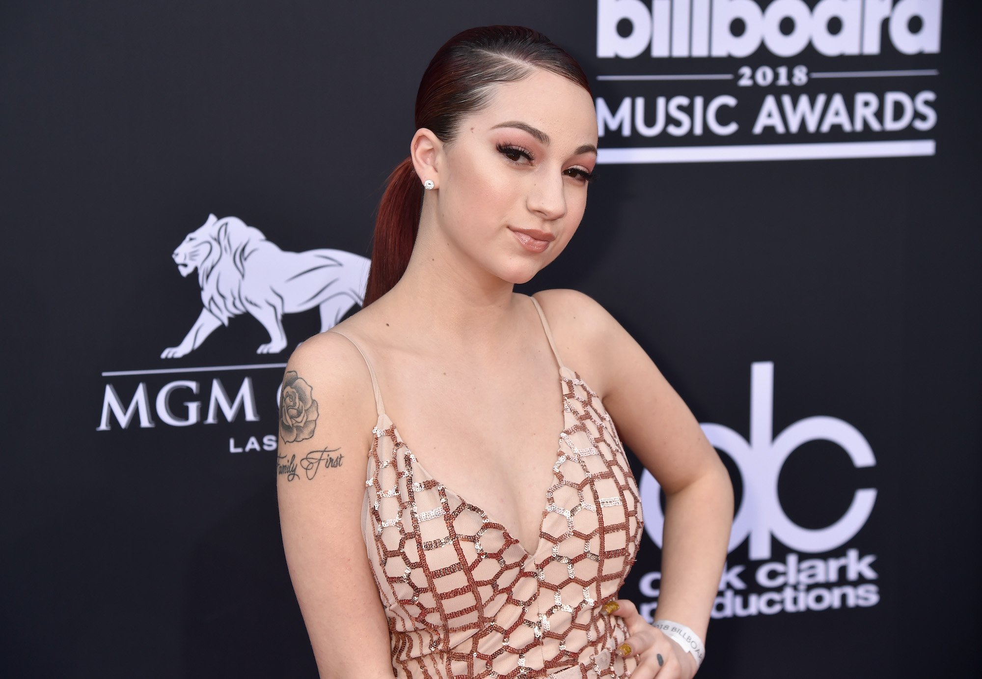 Bhad Bhabie smiling in front of a black background