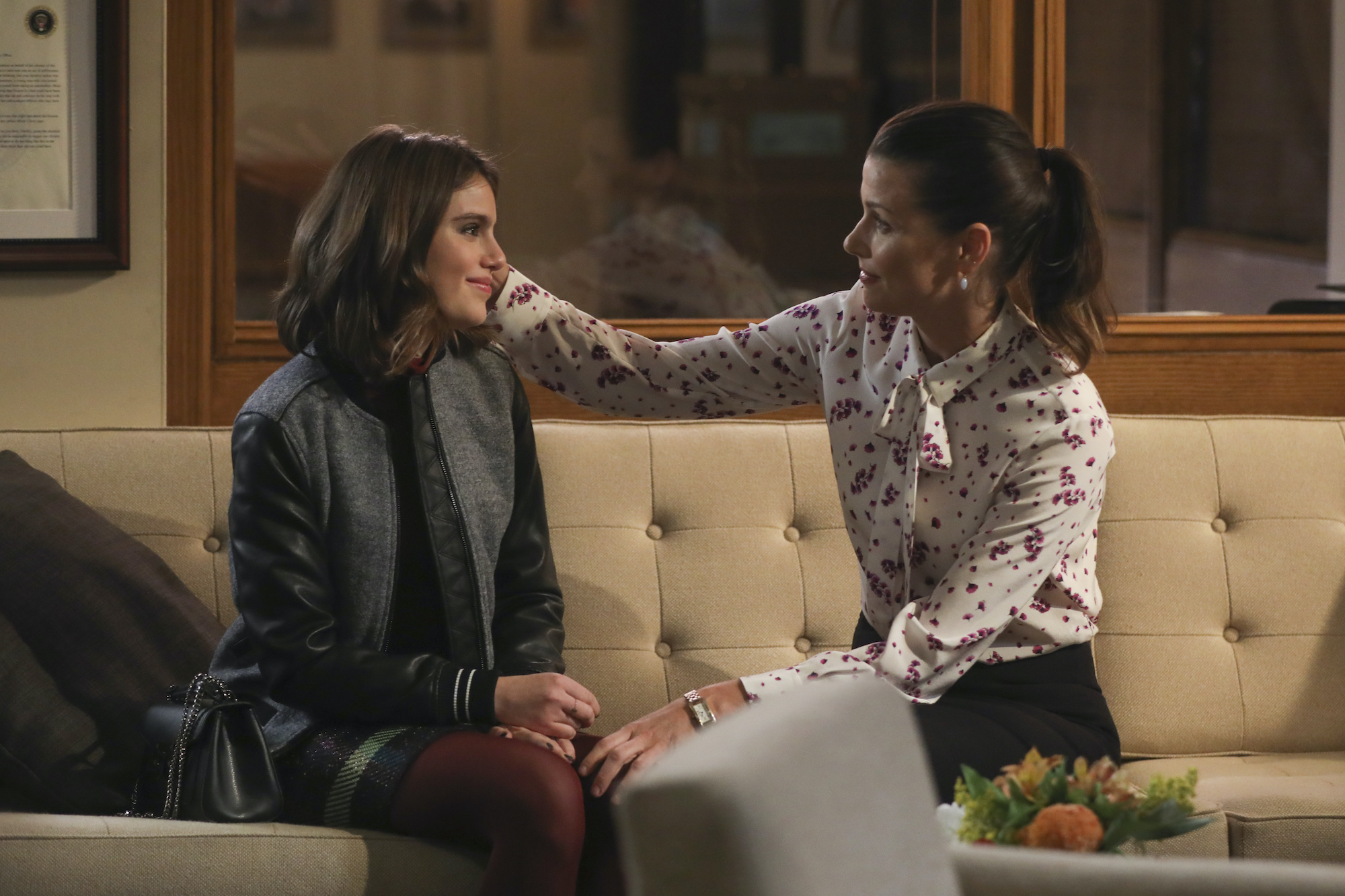 (L-R) Sami Gayle as Nicky Reagan and Bridget Moynahan as Erin Reagan sitting on a couch, facing each other