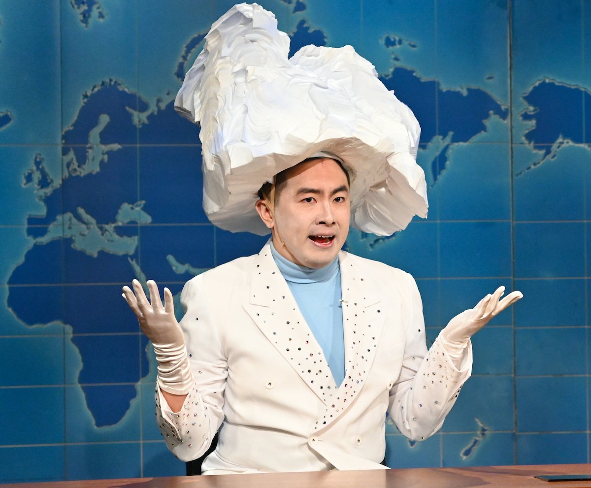 Bowen Yang wearing a white suit and iceberg-shaped hat as 'The Iceberg That Sank The Titanic' on 'Saturday Night Live' on April 10, 2021