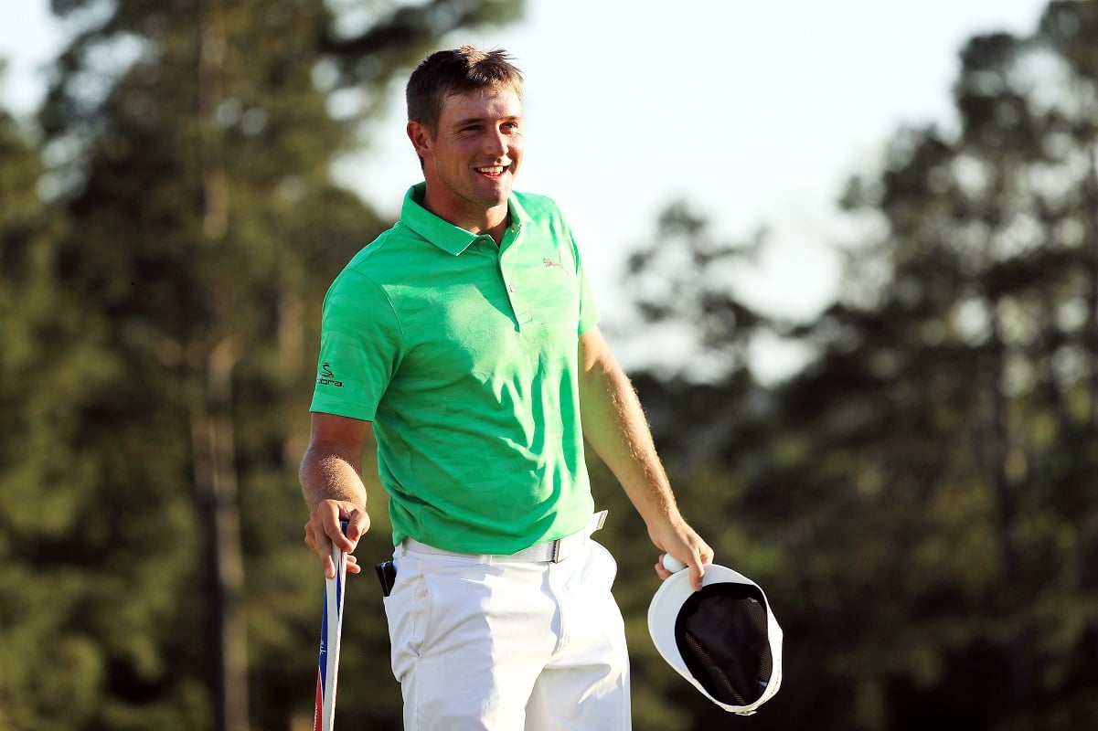 Bryson DeChambeau reacts by smiling on the 18th green during the first round of the Masters in 2019