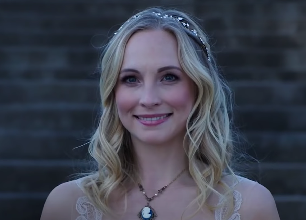Candice King smiles in a wedding dress as Caroline Forbes in 'The Vampire Diaries' Season 8