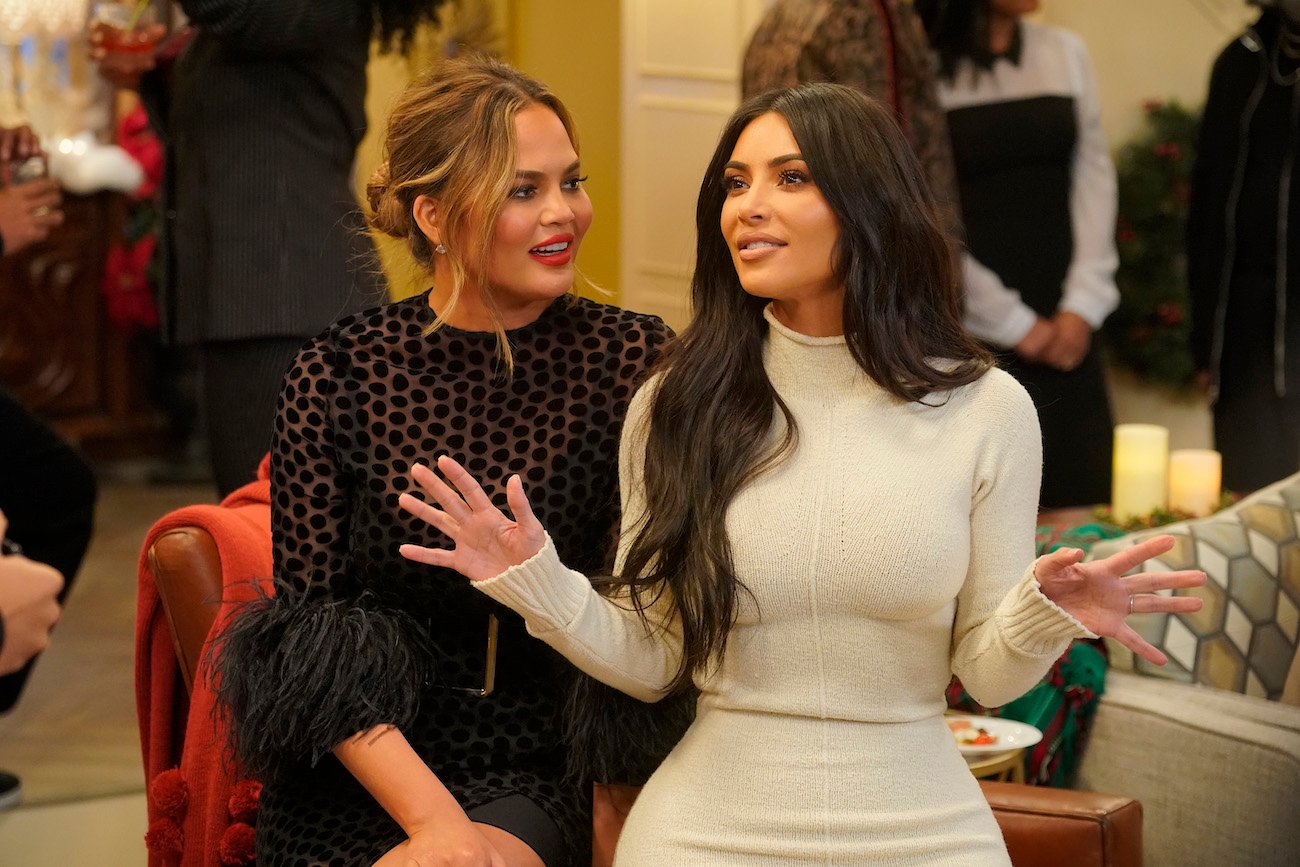 Chrissy Teigen and Kim Kardashian West talking to each other