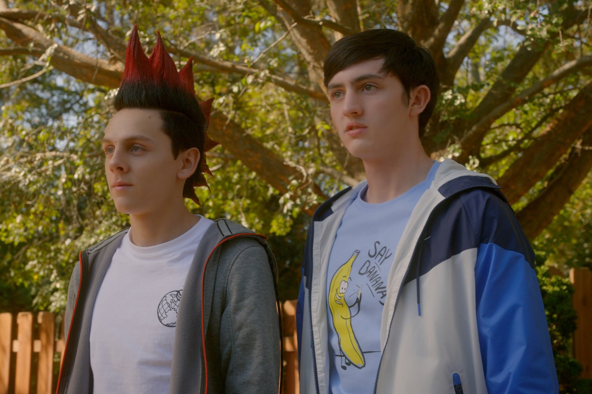 Cobra Kai stars Jacob Bertran and Gianni DeCenzo with open jackets