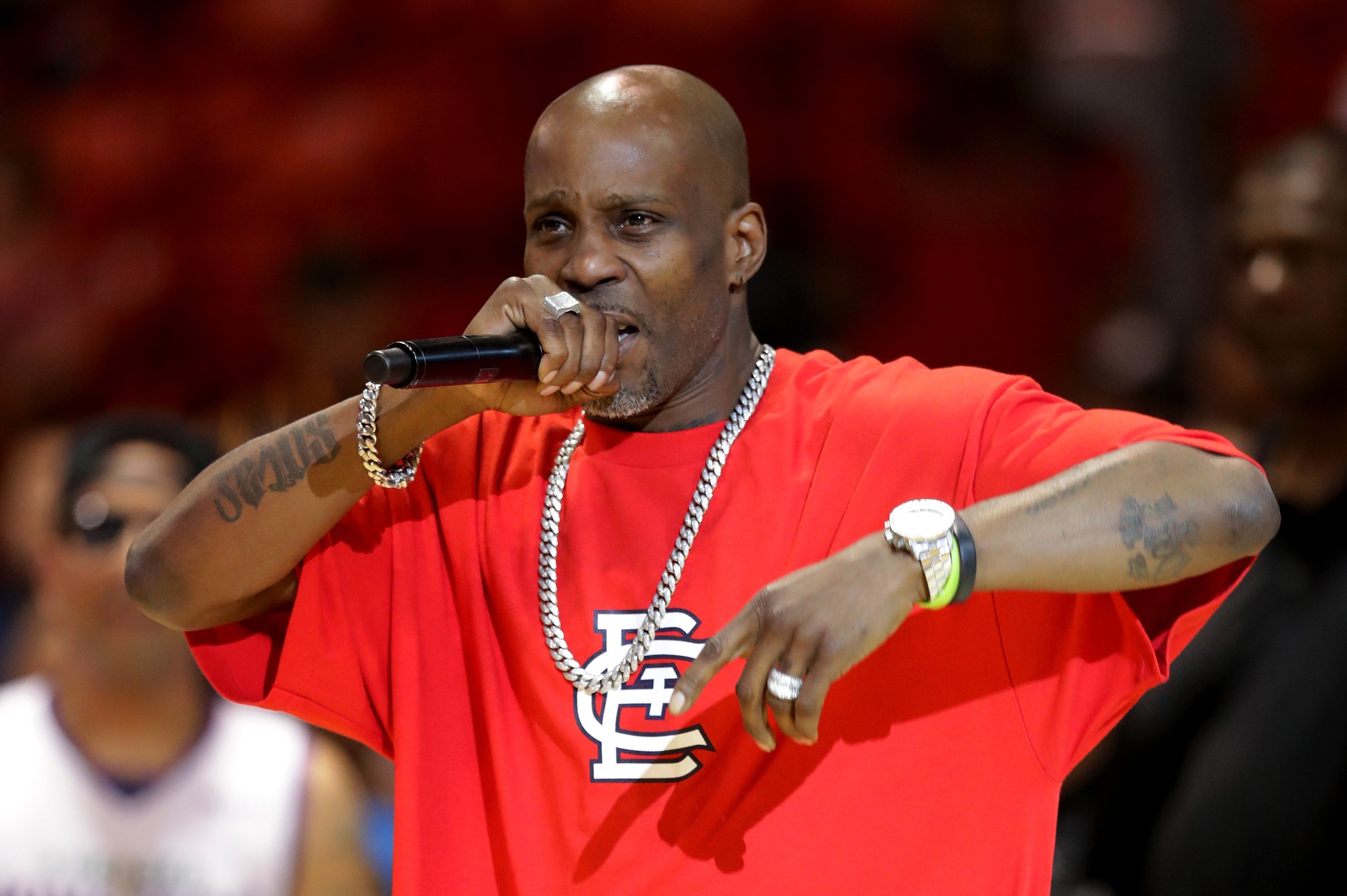 DMX performing at the BIG3 in a red shirt and silver jewelry.