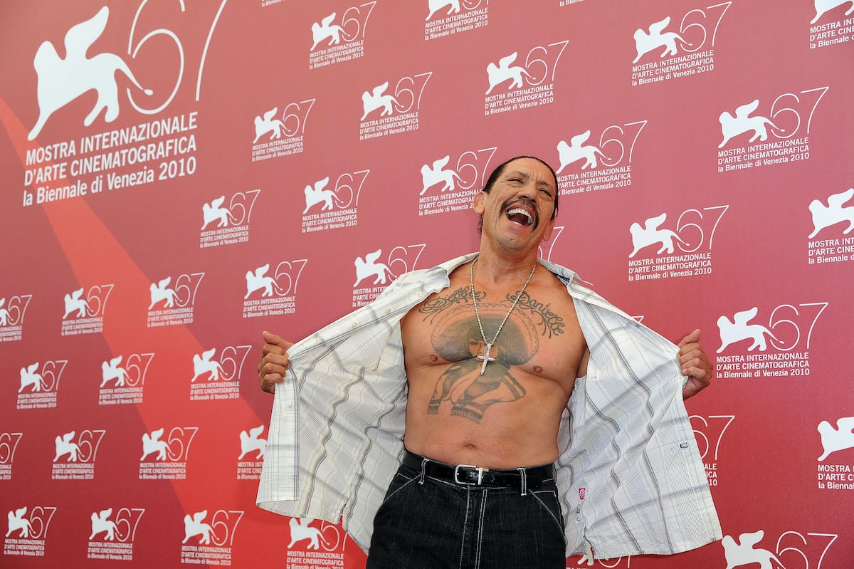 Actor Danny Trejo shows off his chest tattoo while attending the 67th Venice Film Fetsival 