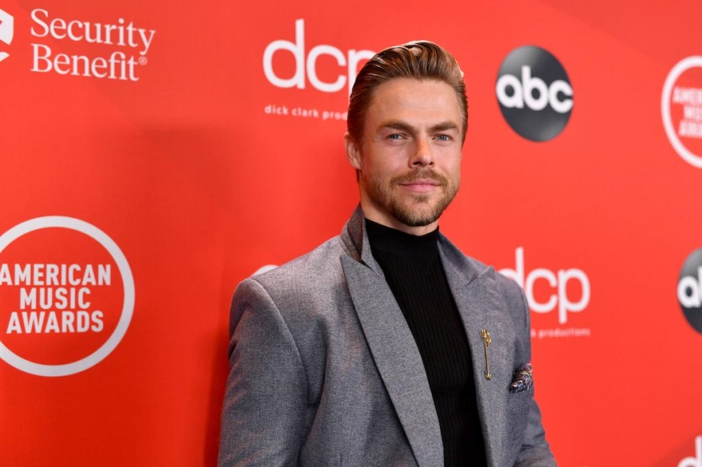 Derek Hough on the ABC red carpet in a grey suit