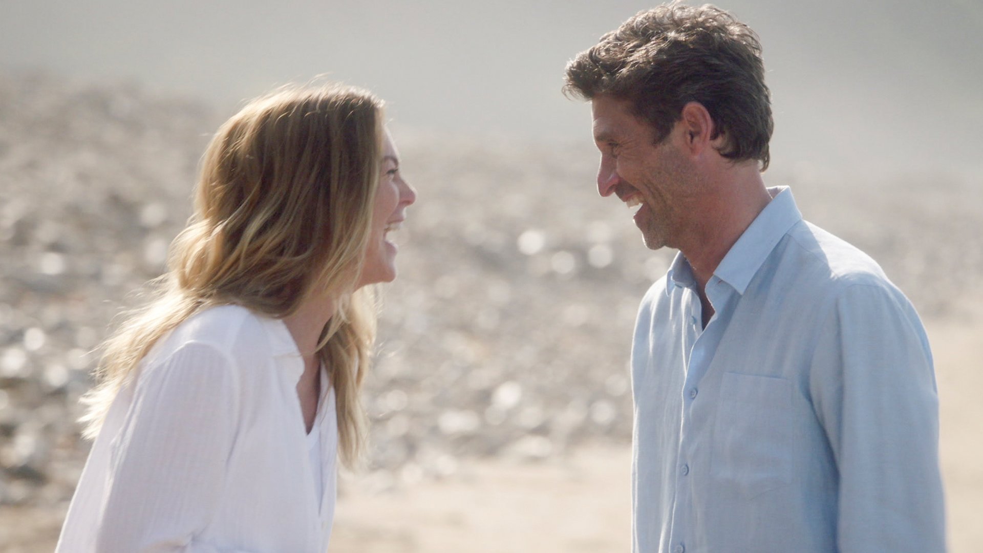 Ellen Pompeo as Meredith Grey and Patrick Dempsey as Derek Shepherd laughing together in ‘Grey’s Anatomy’ Season 17 Episode 13