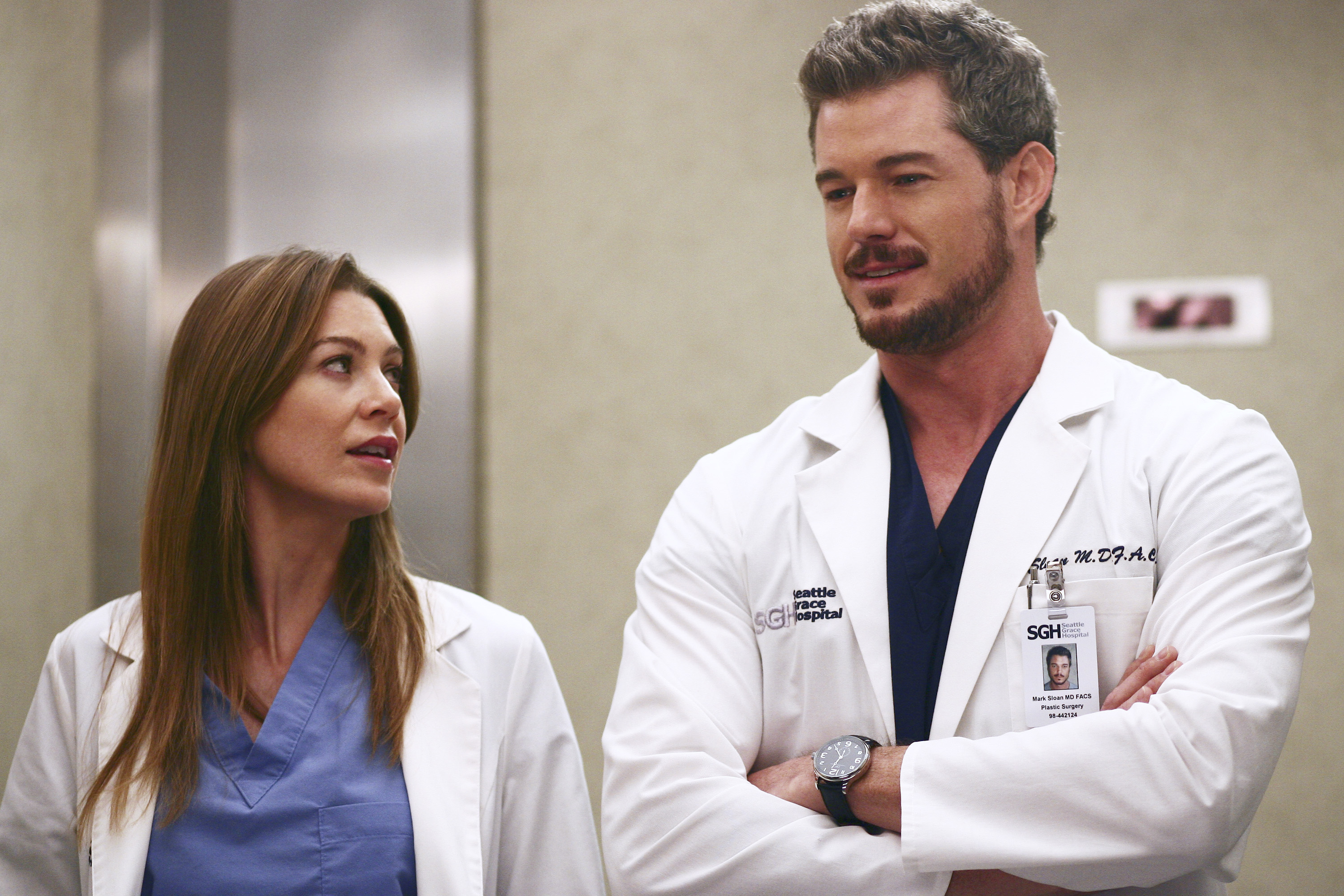Ellen Pompeo and Eric Dane wearing scrubs in a scene from 'Grey's Anatomy' 