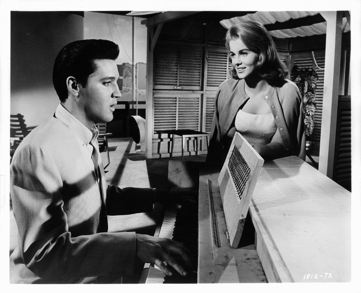 Ann-Margret watches Elvis Presley play the piano in a scene from the film 'Viva Las Vegas', 1964.