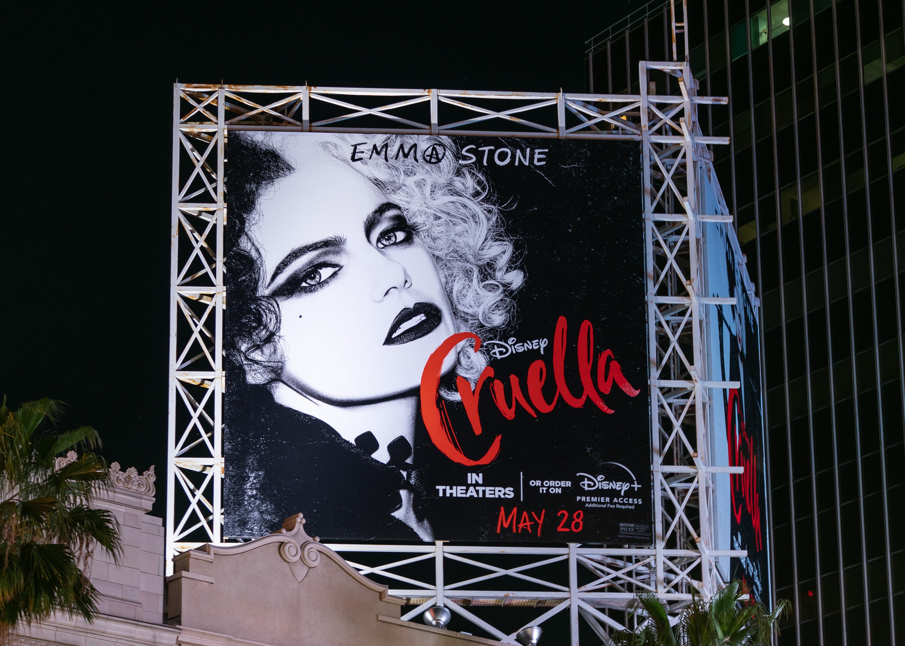 General view of a billboard above the El Capitan Entertainment Centre promoting Walt Disney Pictures 'Cruella' in theaters and Disney+