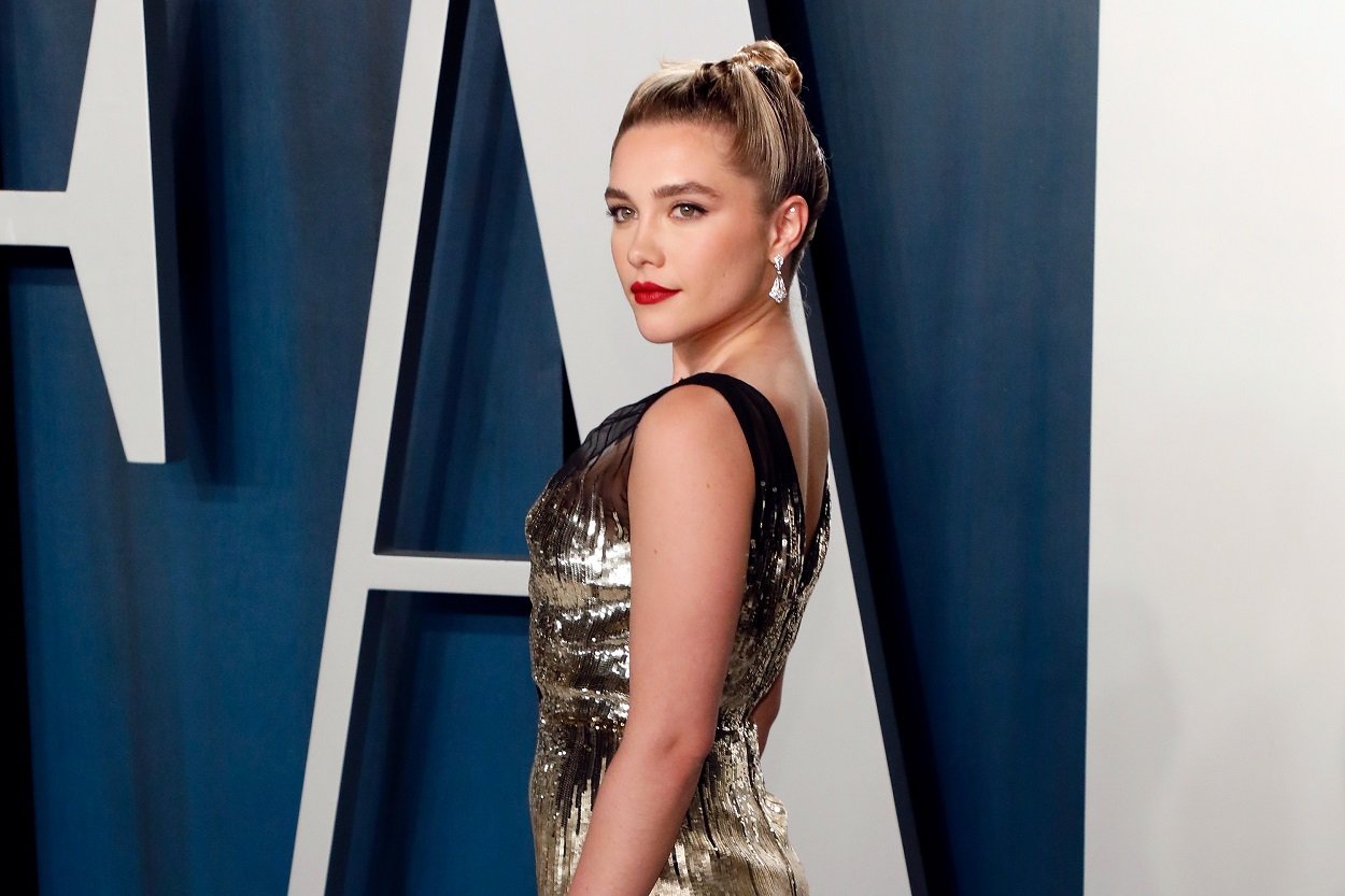 Florence Pugh attends the 2020 Vanity Fair Oscar Party in a ballgown and updo