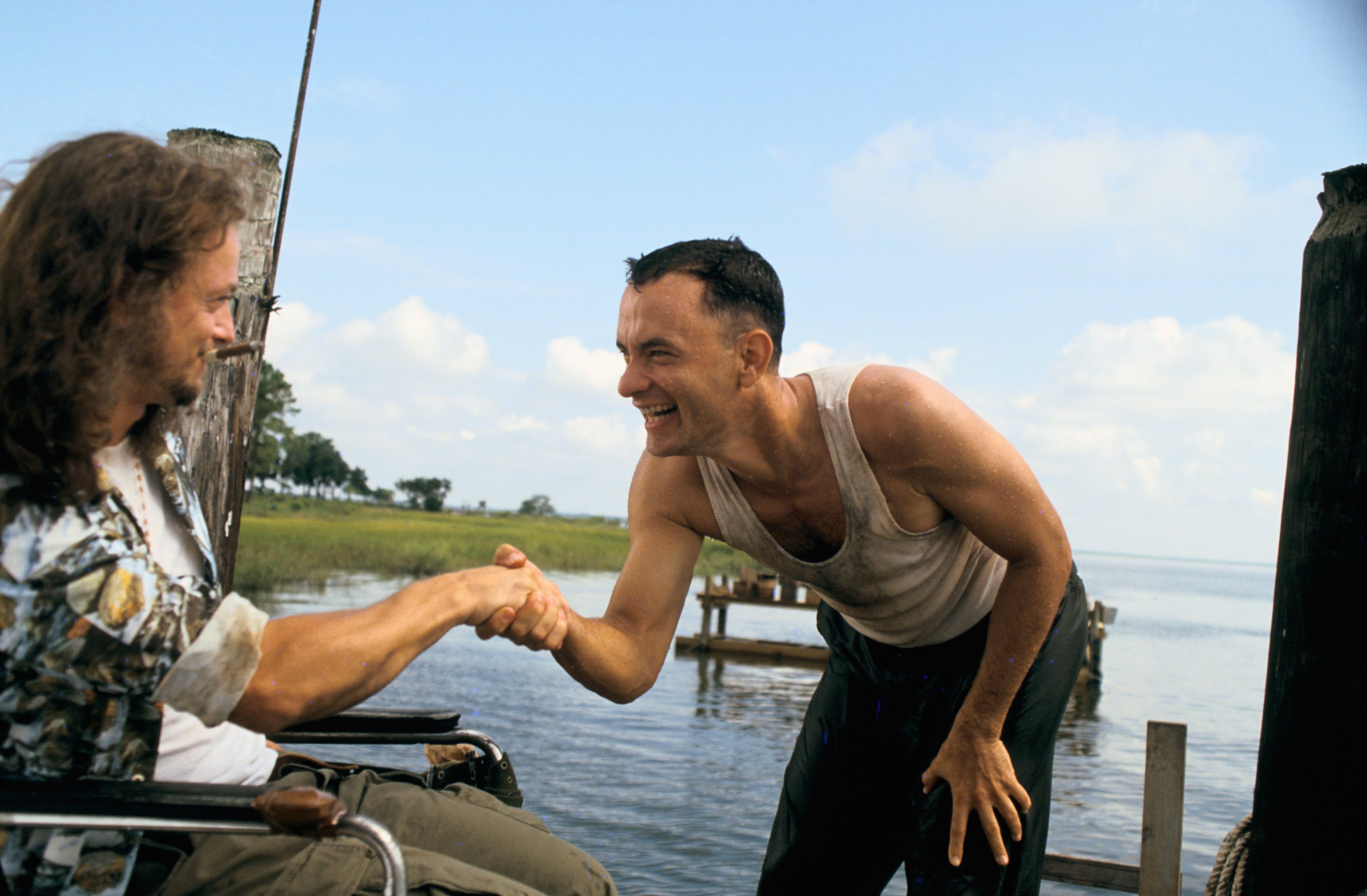 Tom Hanks shakes Gary Sinise's hands