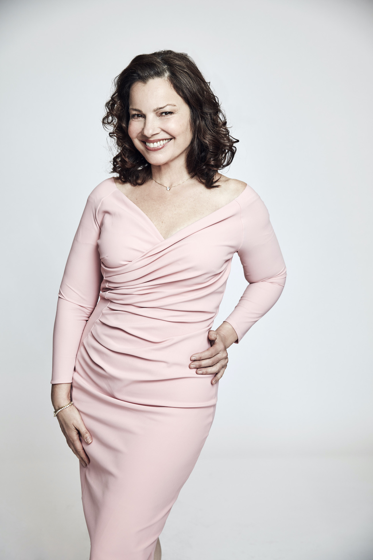 Fran Drescher poses in pink dress