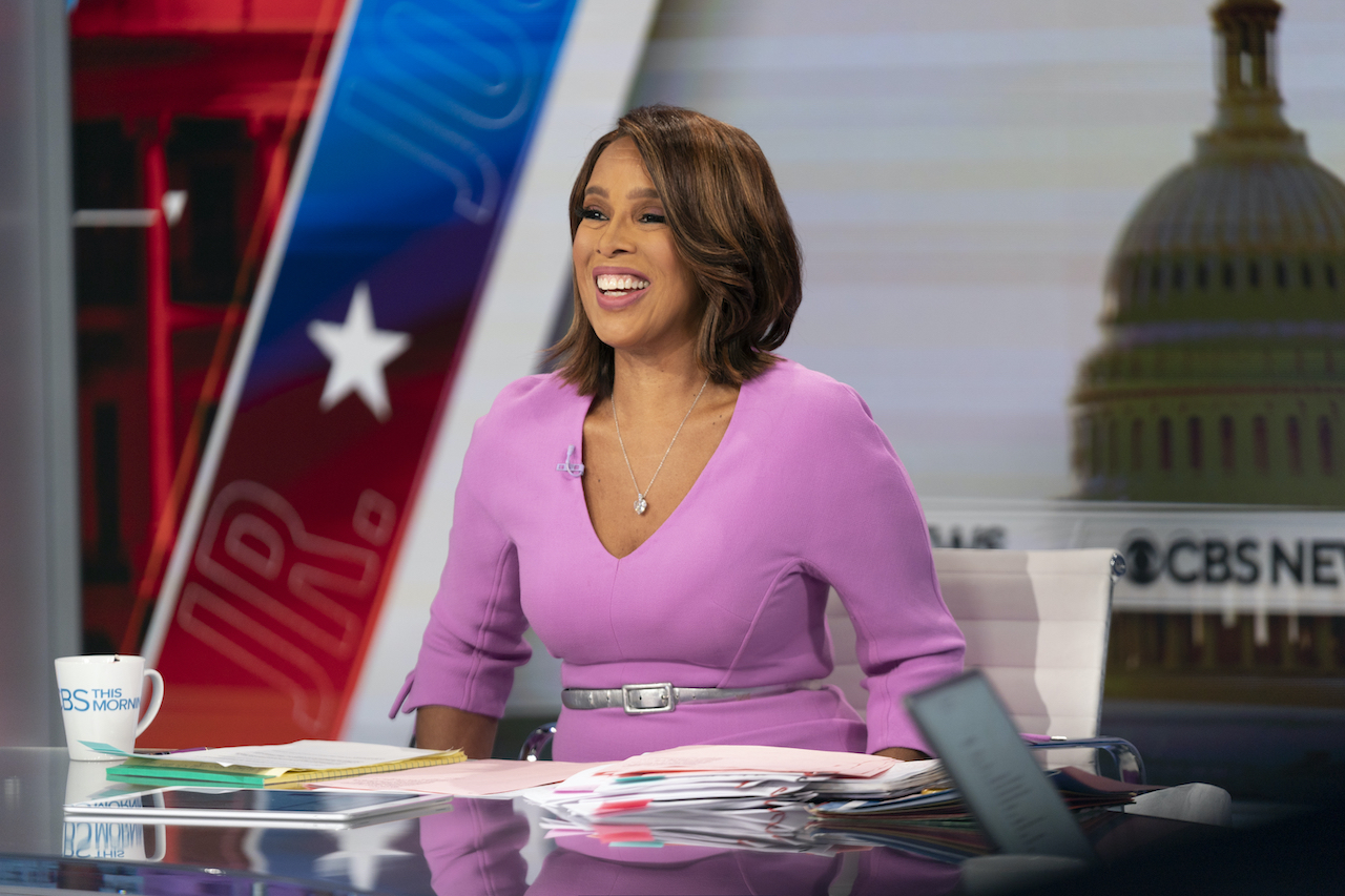 'CBS This Morning' co-host Gayle King smiling in a pink dress at the news desk and broadcasts live from Washington, D.C.