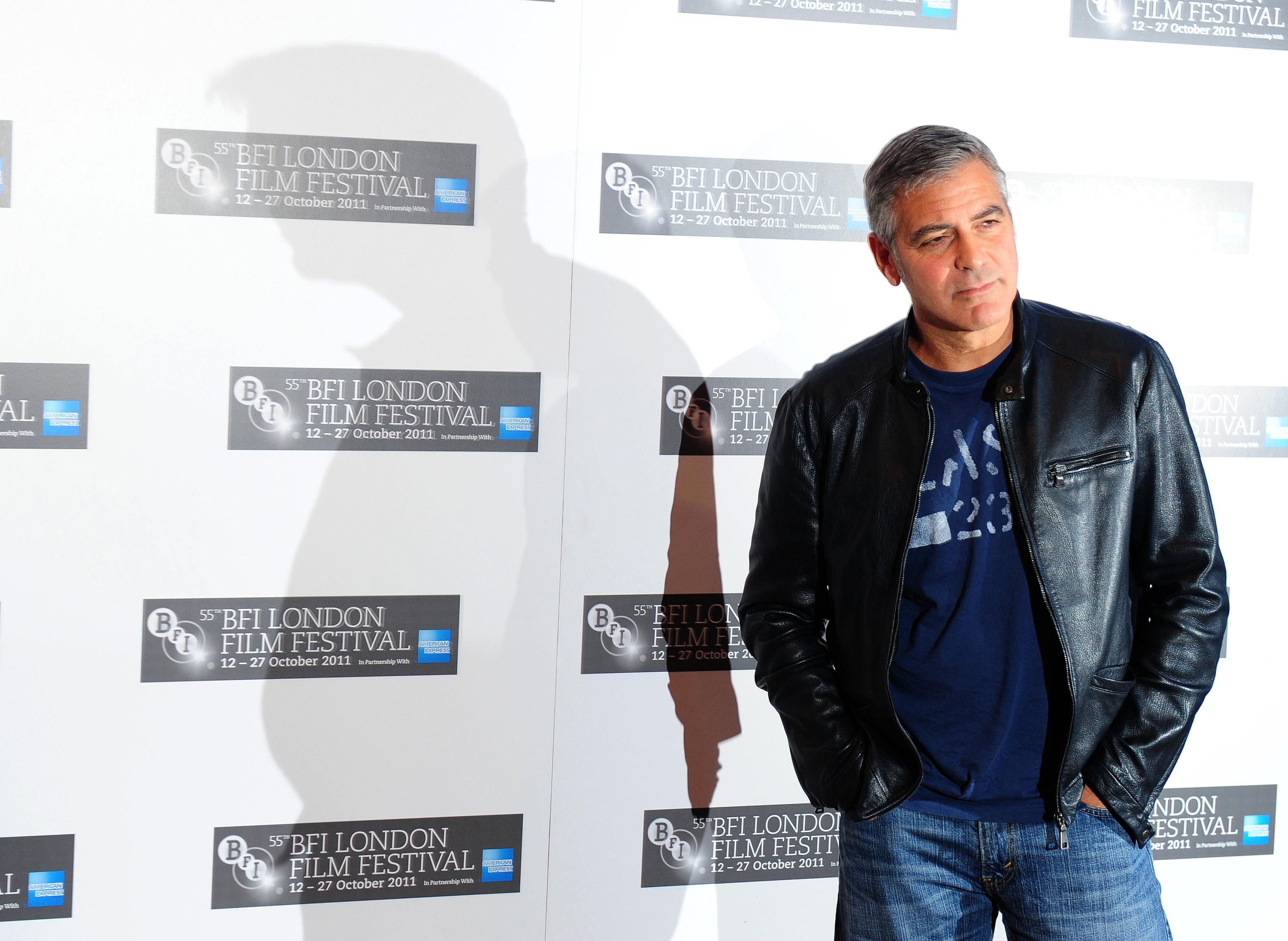George Clooney posing for photographers at the BFI London Film Festival.