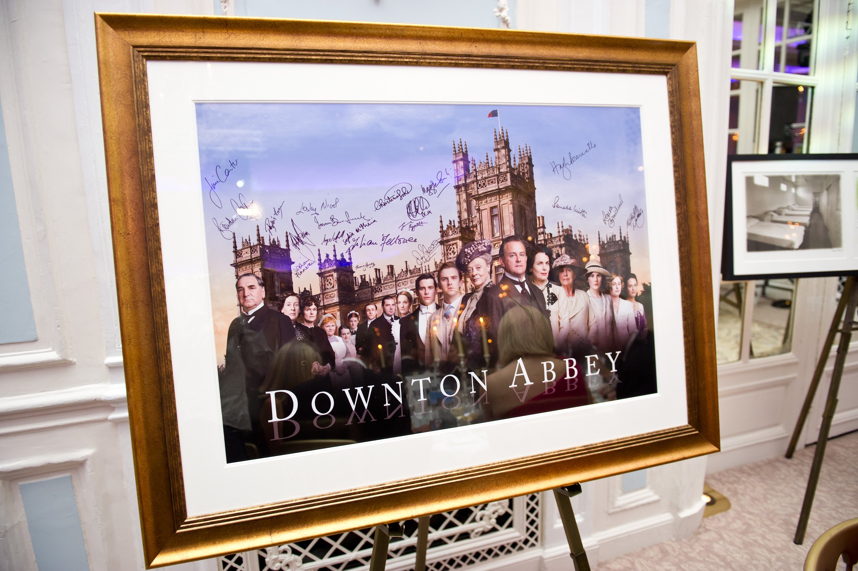 A signed and framed promotional poster for 'Downton Abbey'