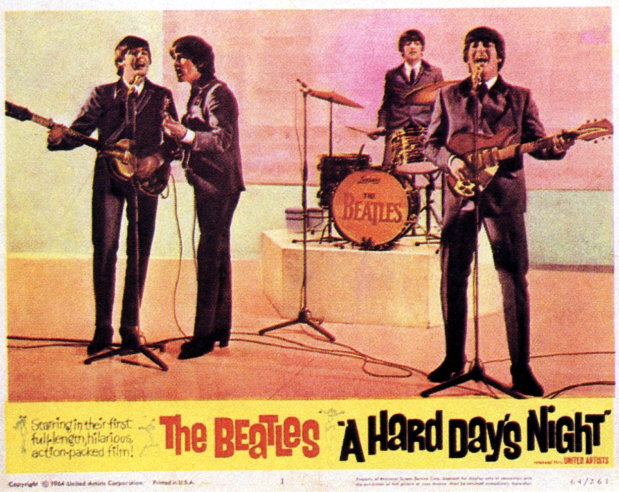 A promotional poster for The Beatles 1964 film 'A Hard Day's Night' shows the band performing on stage