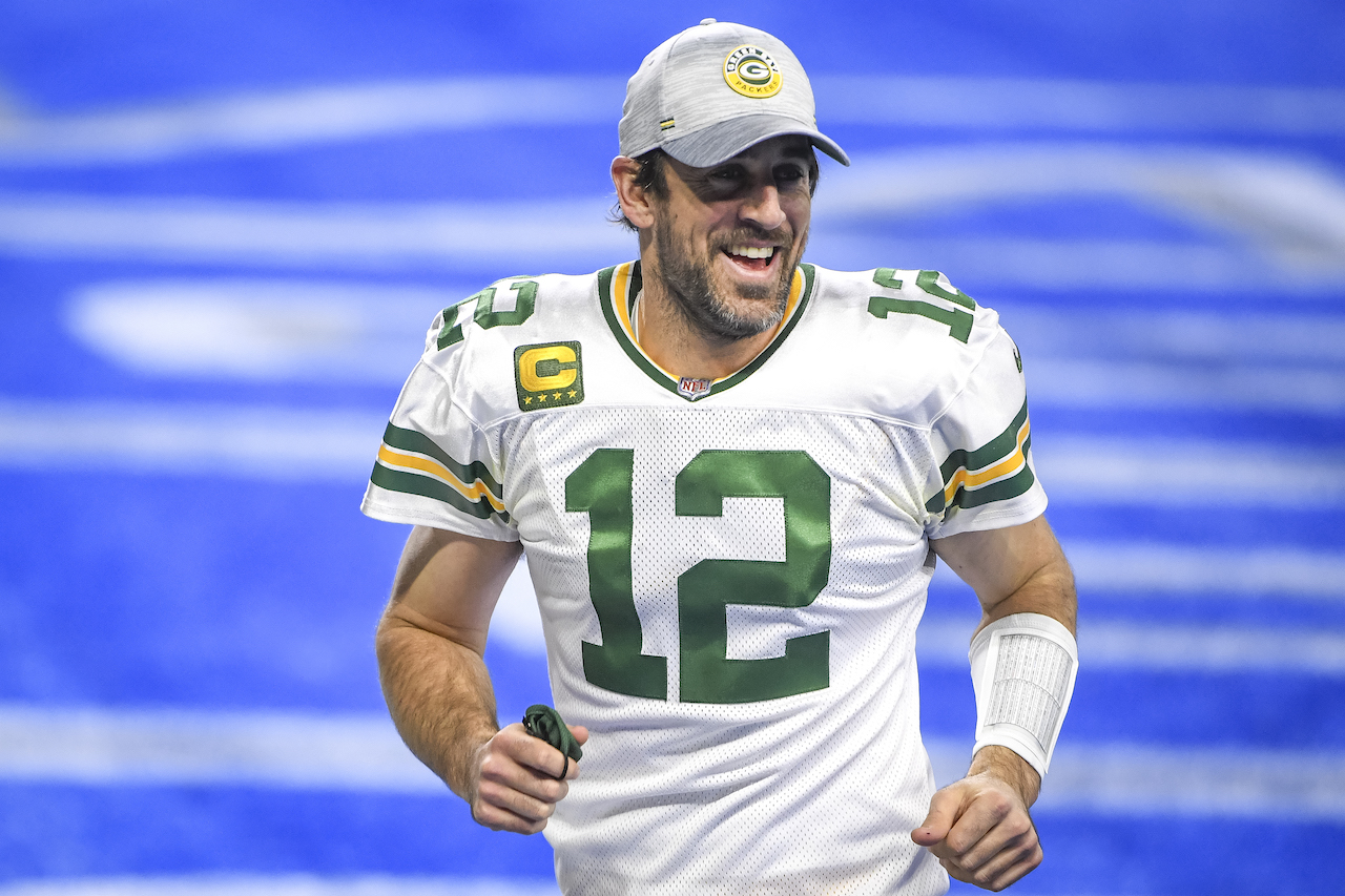 Aaron Rodgers of the Green Bay Packers looks on and smiles after the win against the Detroit Lions at Ford Field