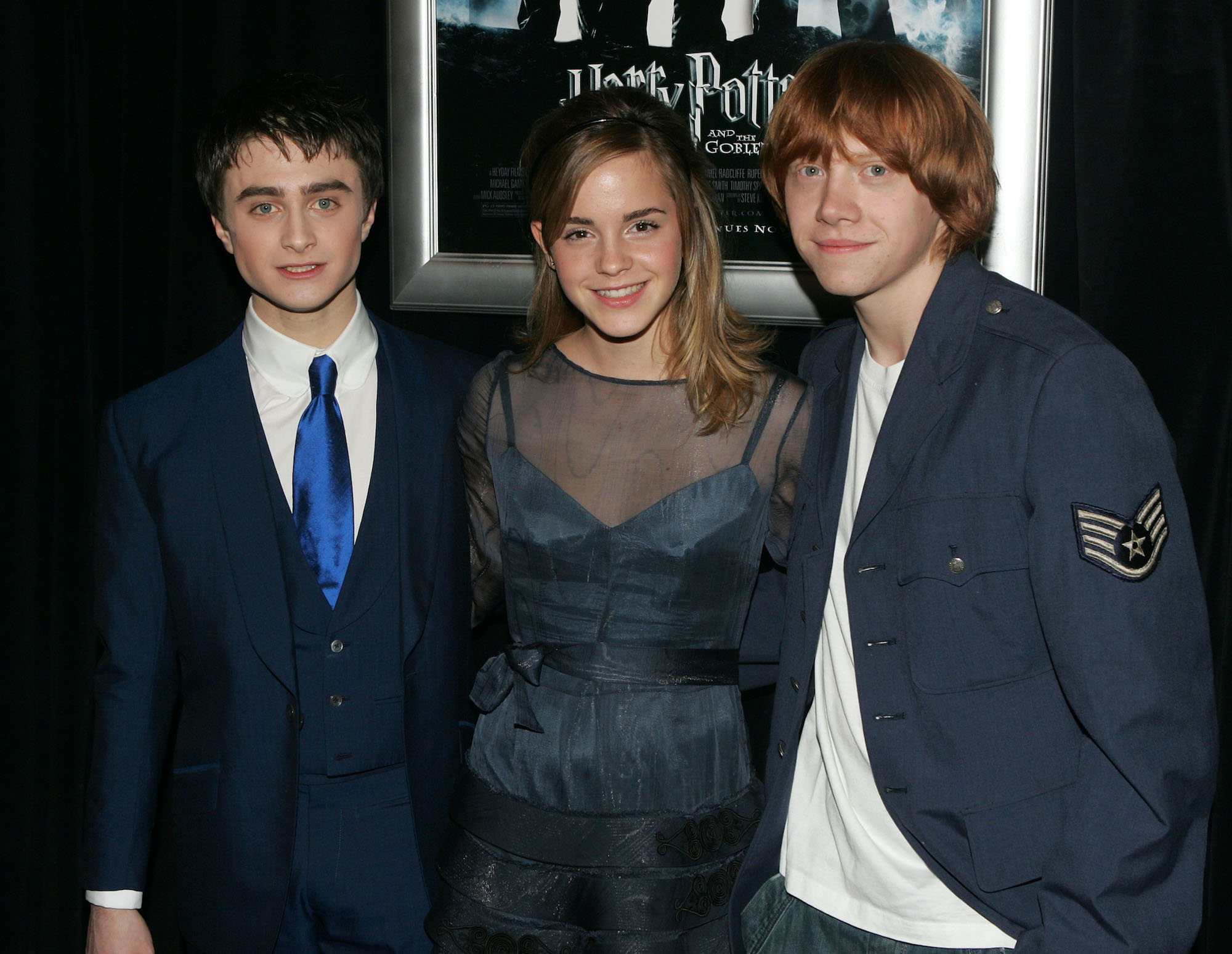Daniel Radcliffe, Emma Watson and Rupert Grint in 2005, smiling