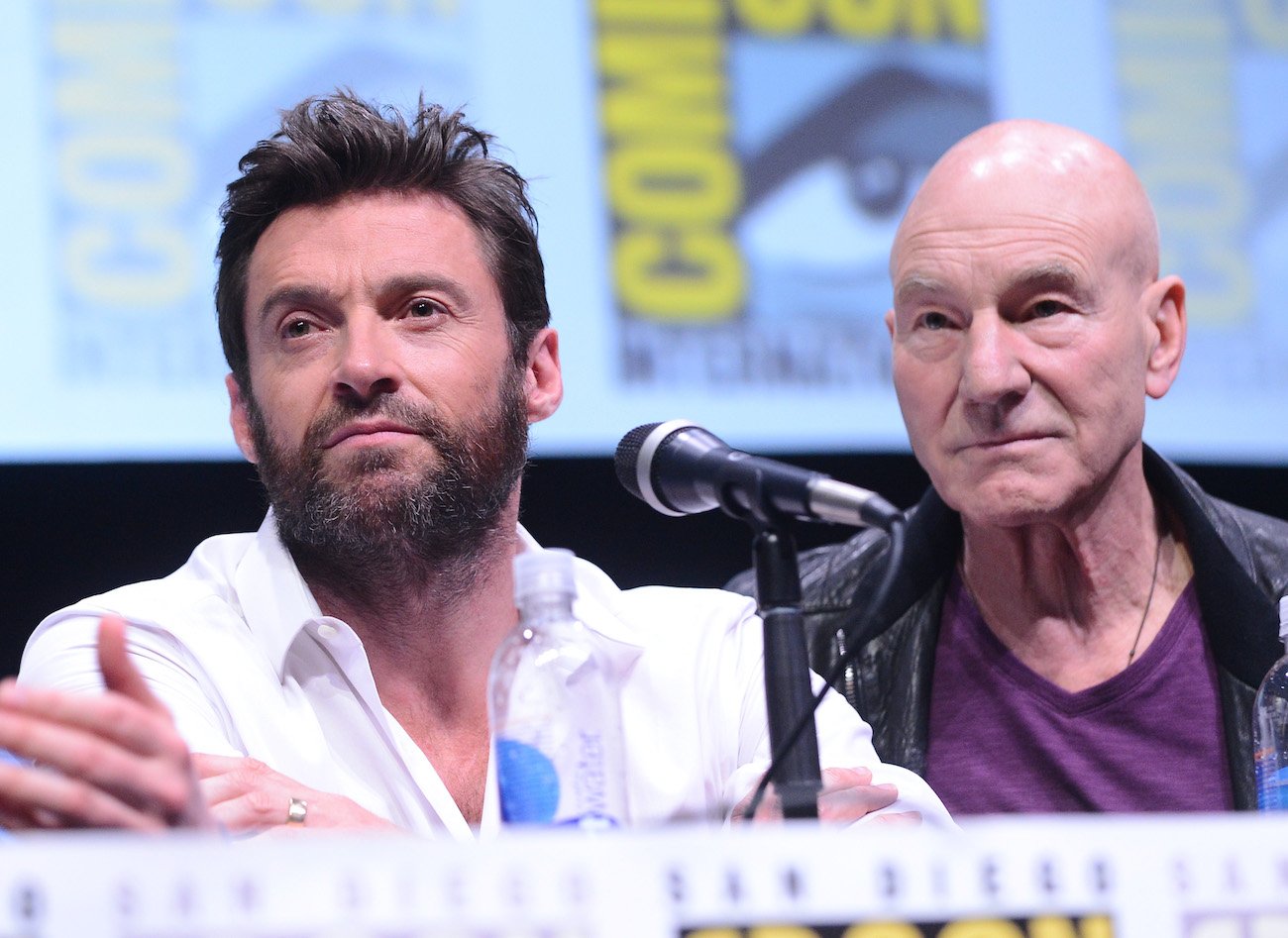 Hugh Jackman and Patrick Stewart sitting at Comic-Con