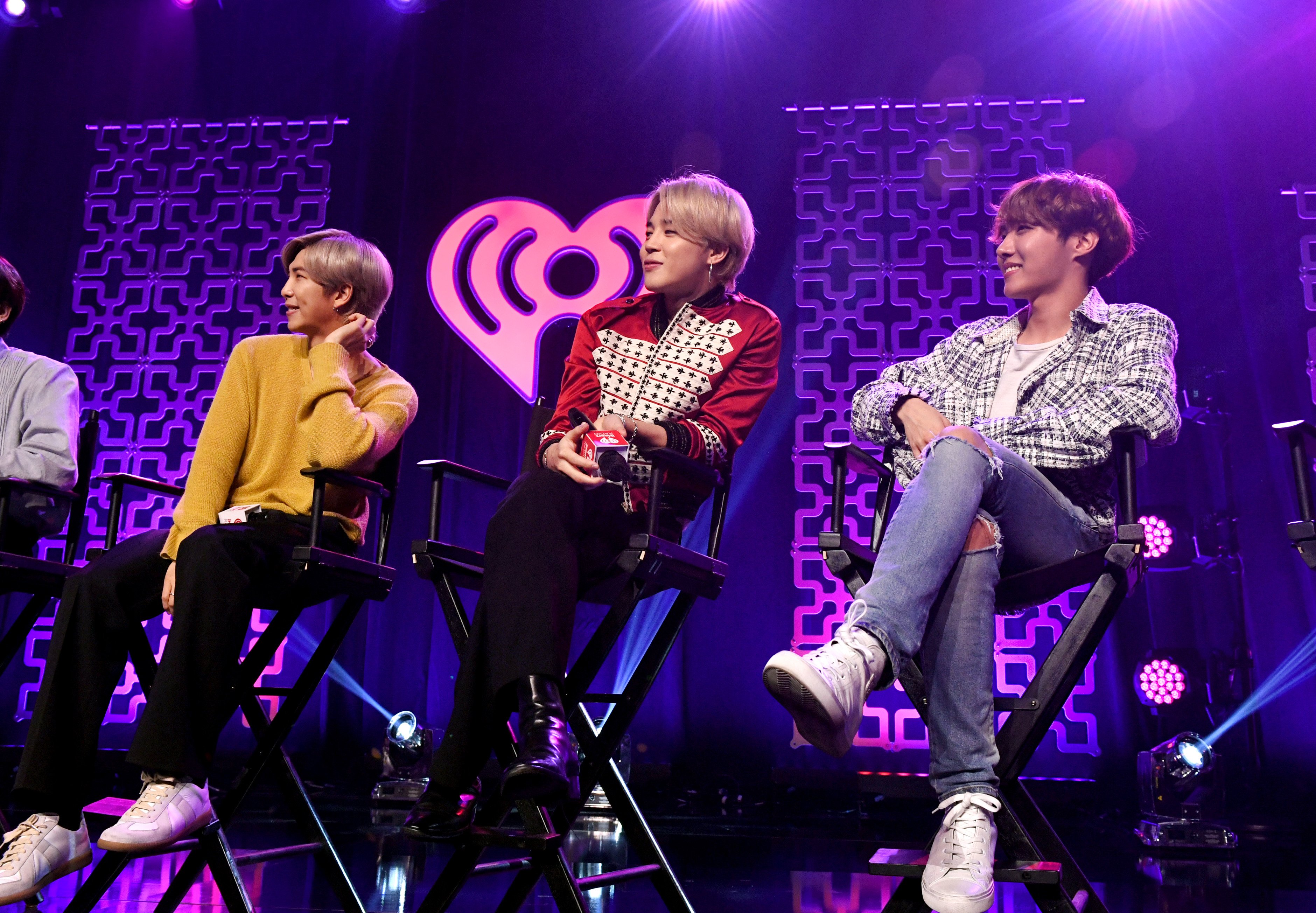 RM, Jimin, and J-Hope of BTS speak on stage at iHeartRadio LIVE with BTS