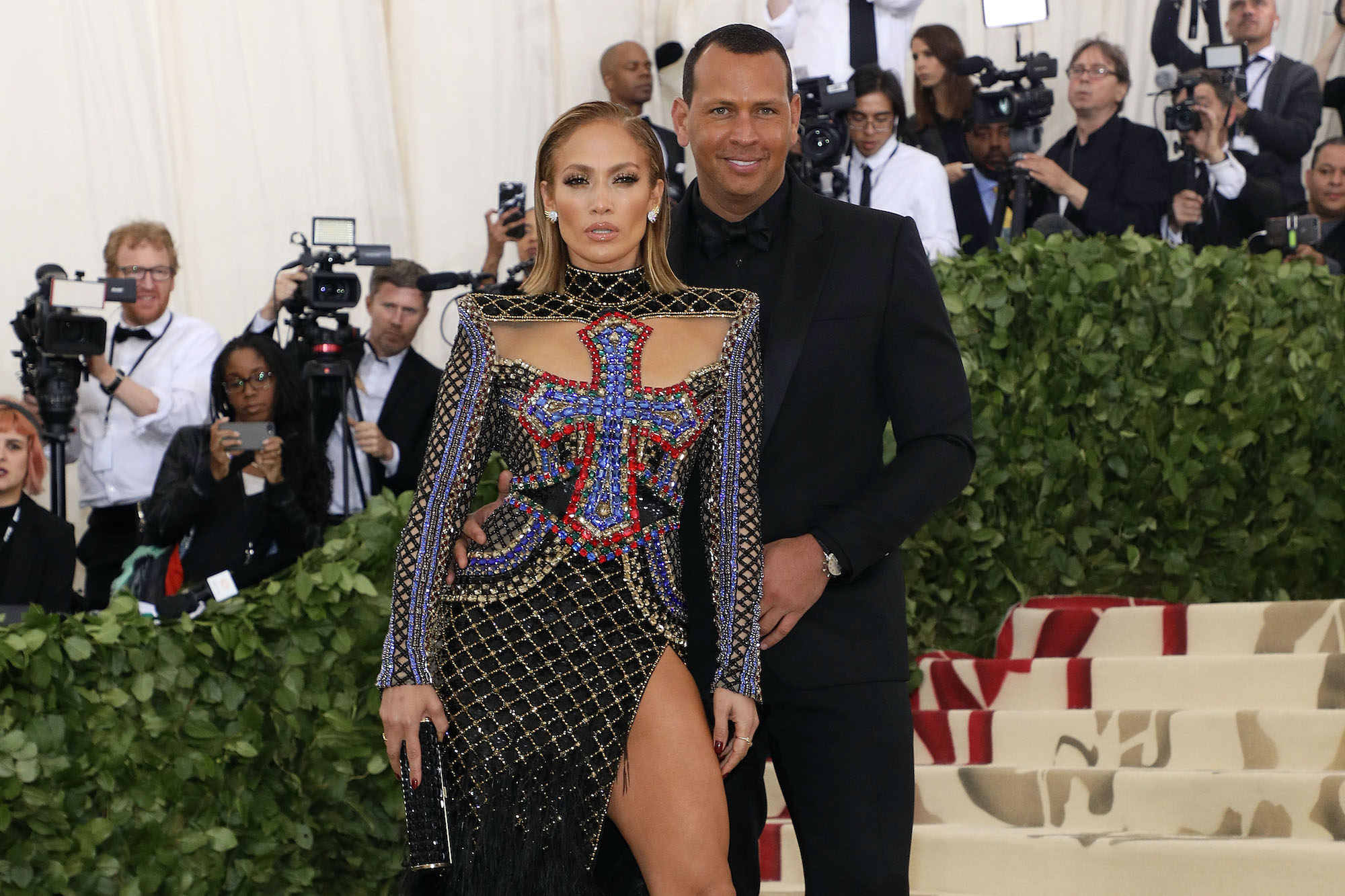 Jennifer Lopez and Alex Rodriguez in front of a crowd of photographers