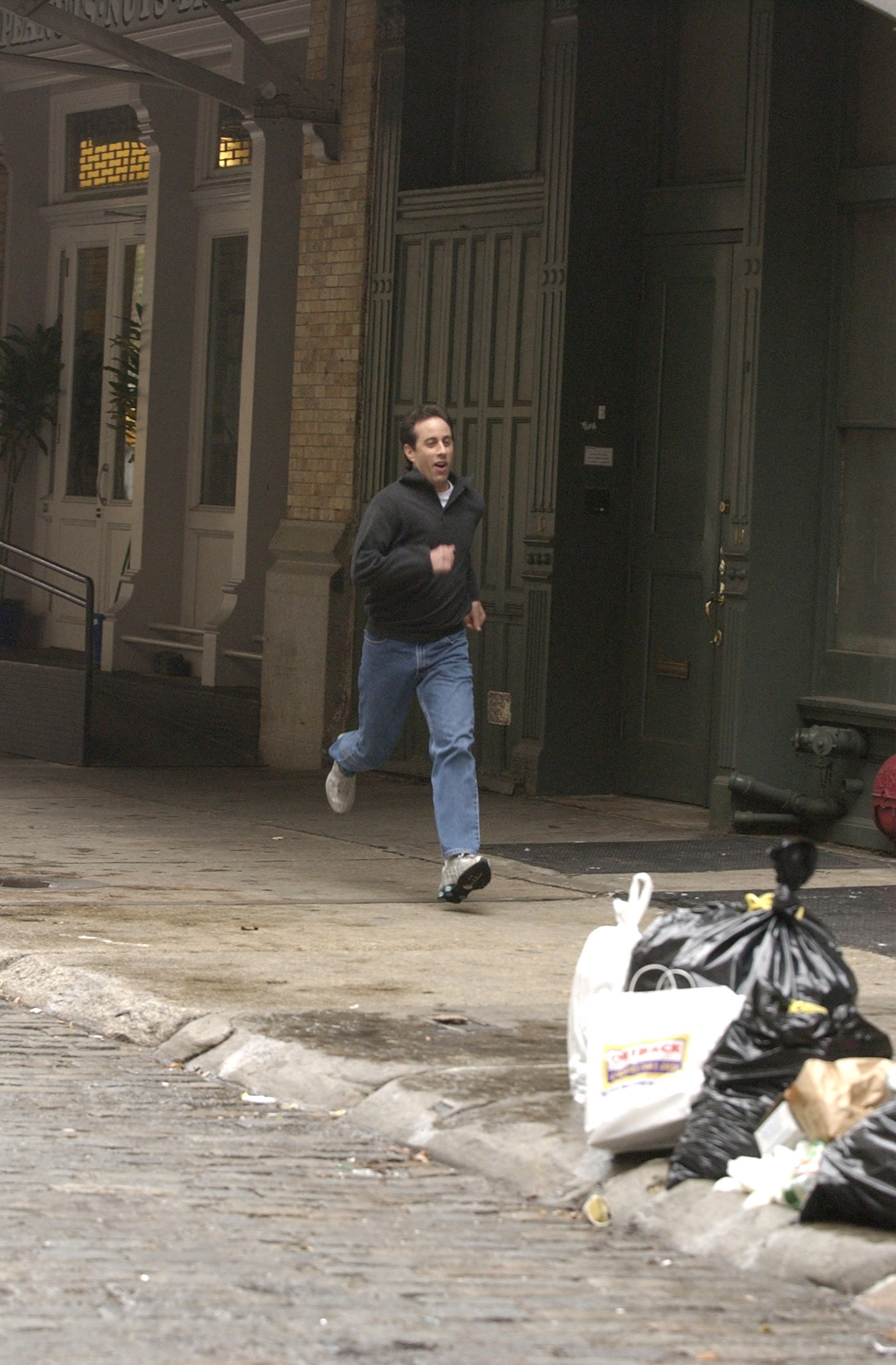 Jerry Seinfeld is seen running down the streets of Lower Manhattan while filming a Webisode for American Express