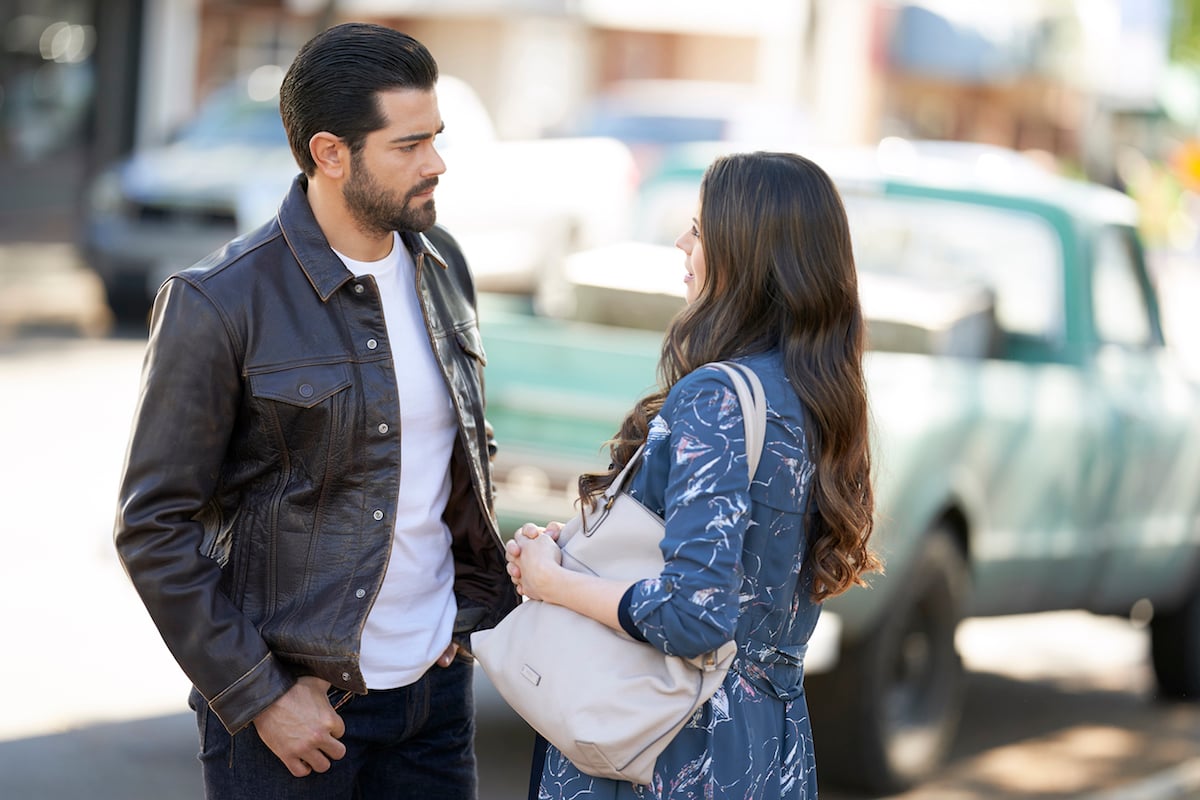 Jesse Metcafle standing on street and talking to Meghan Ory in Chesapeake Shores